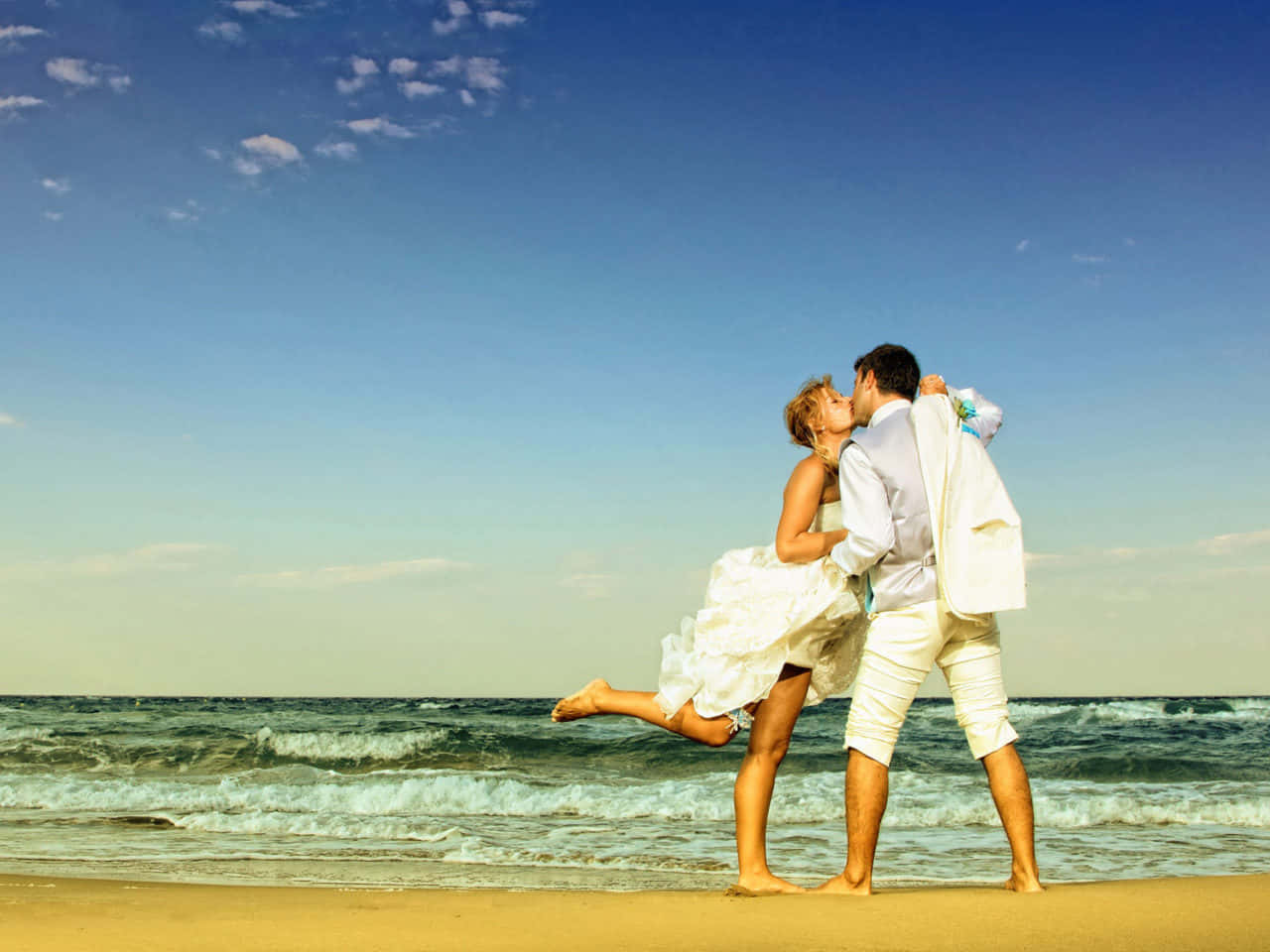 Couple At Beach Kissing Under Blue Sky Picture