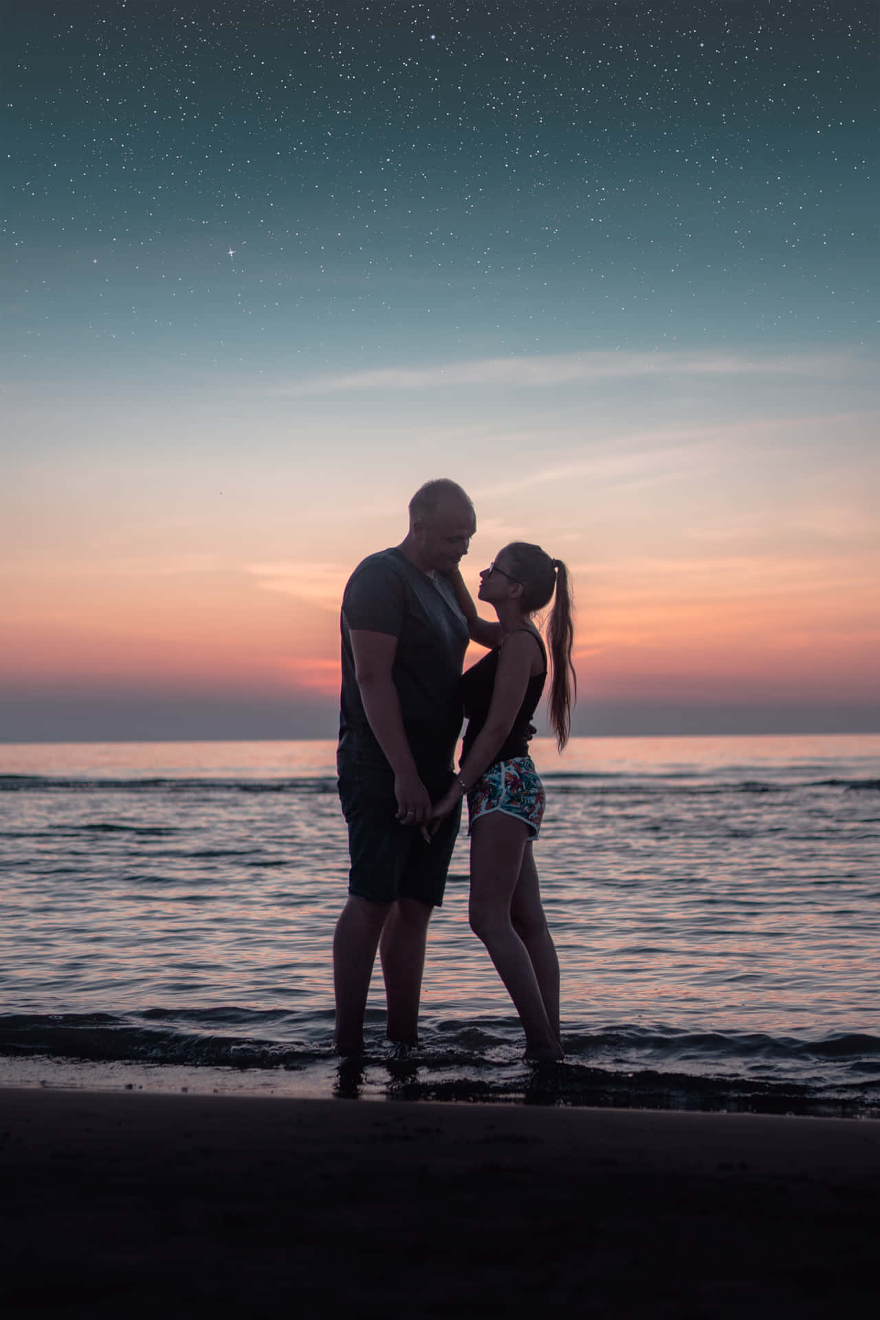 Couple At Beach Twilight Shot Wallpaper