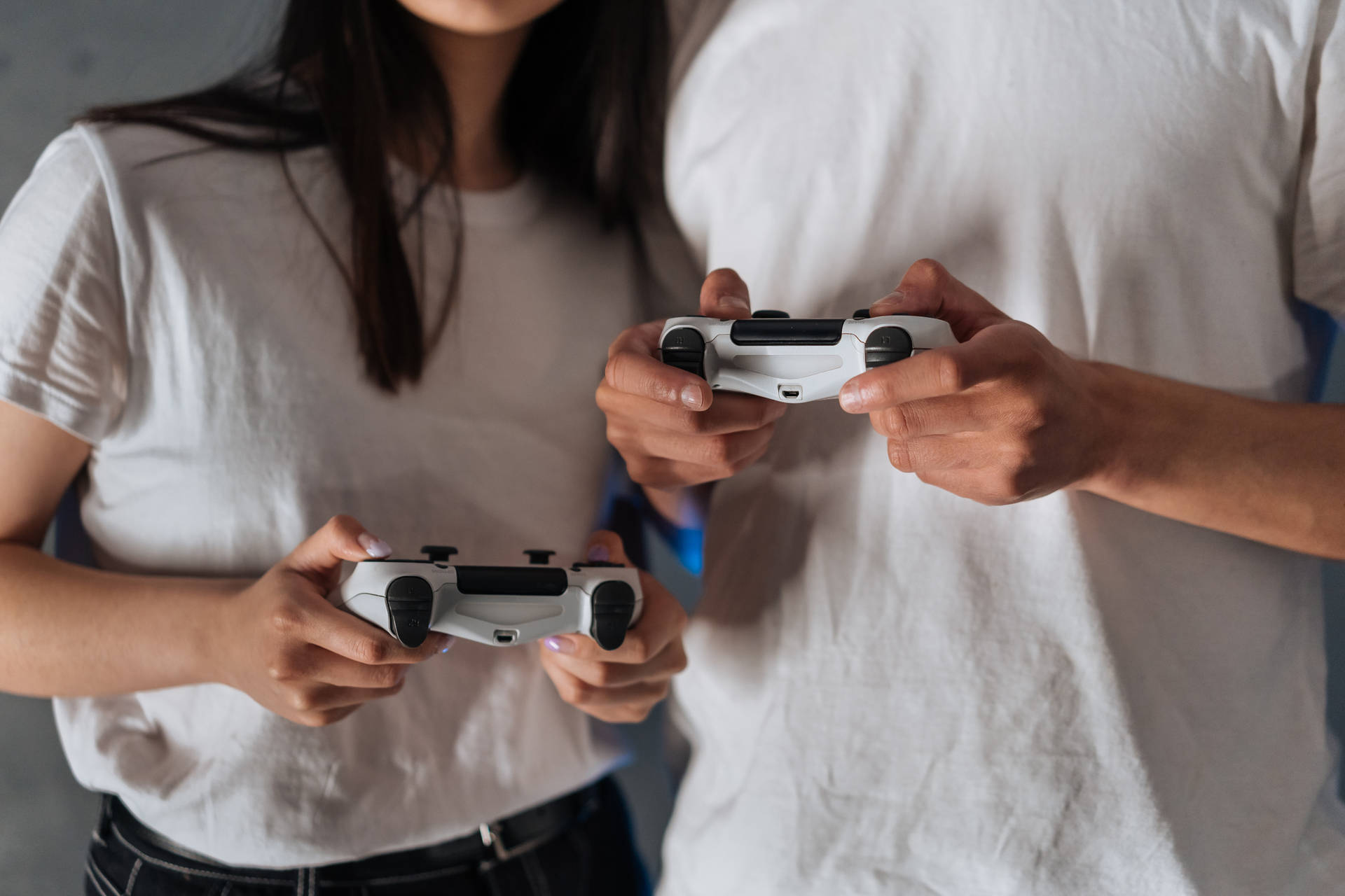 Couple Hands Gaming Controllers