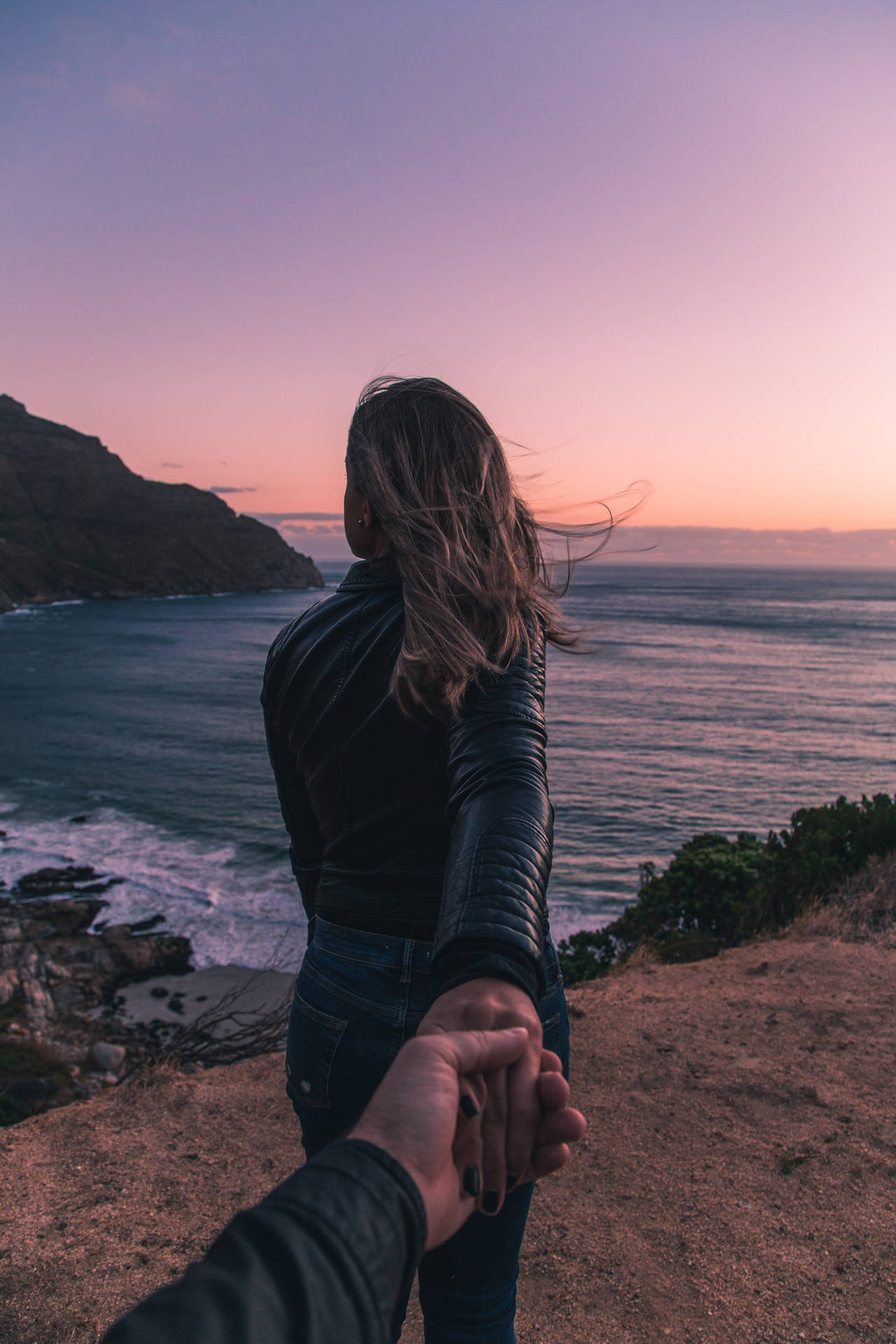 Couple Hands Ocean Cliffside