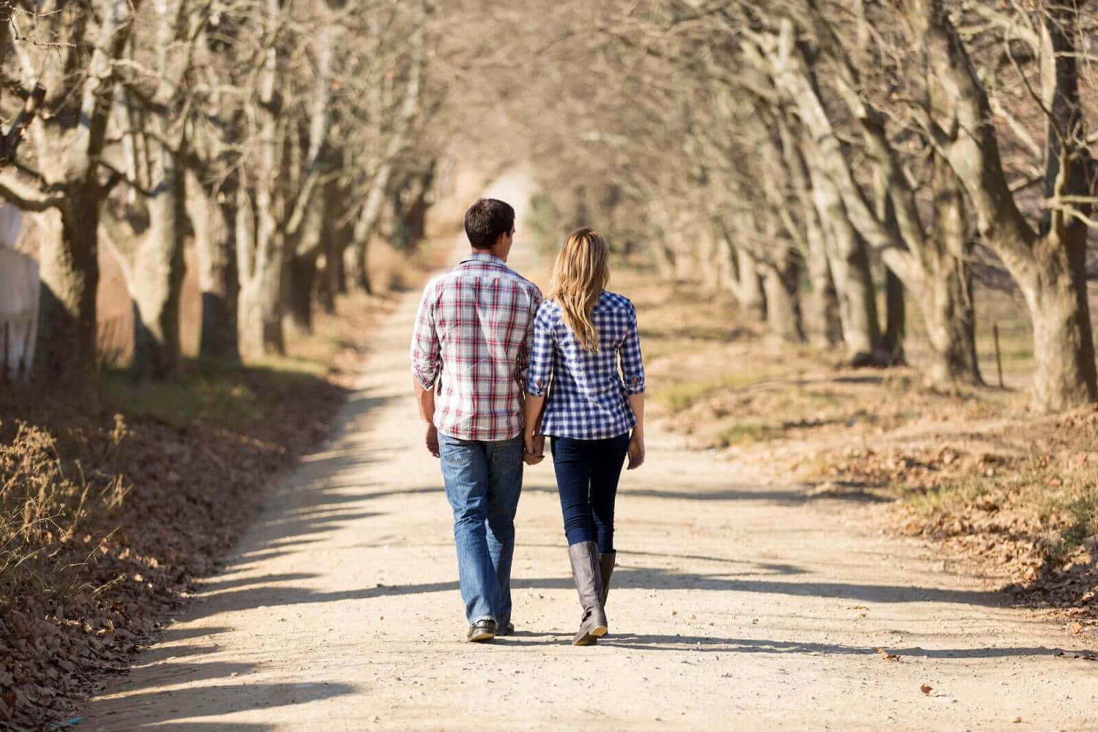 Picture Of Couple In Matching Shirts Holding Hands