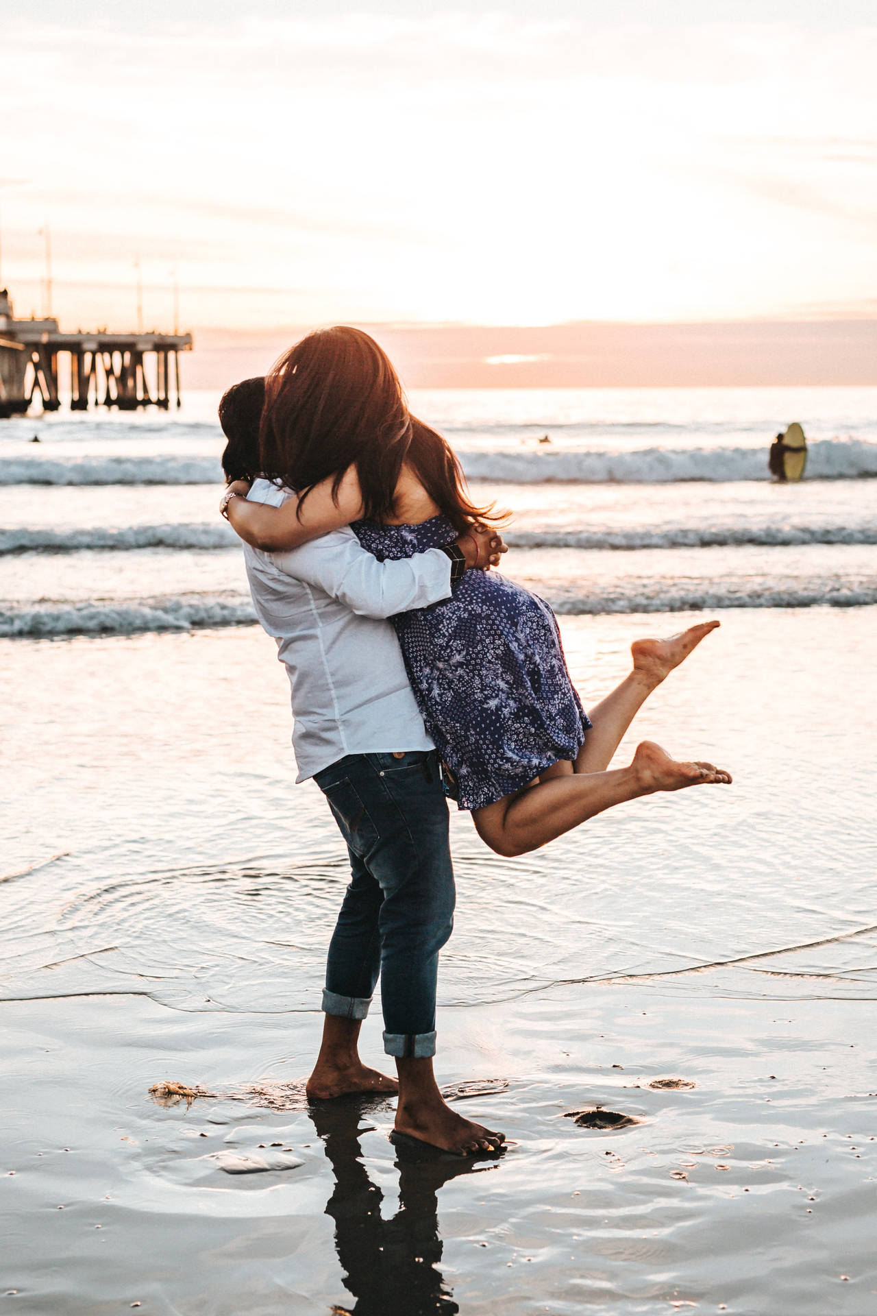 Couple Hugging Catcher Hug On Beach At Sunset Wallpaper