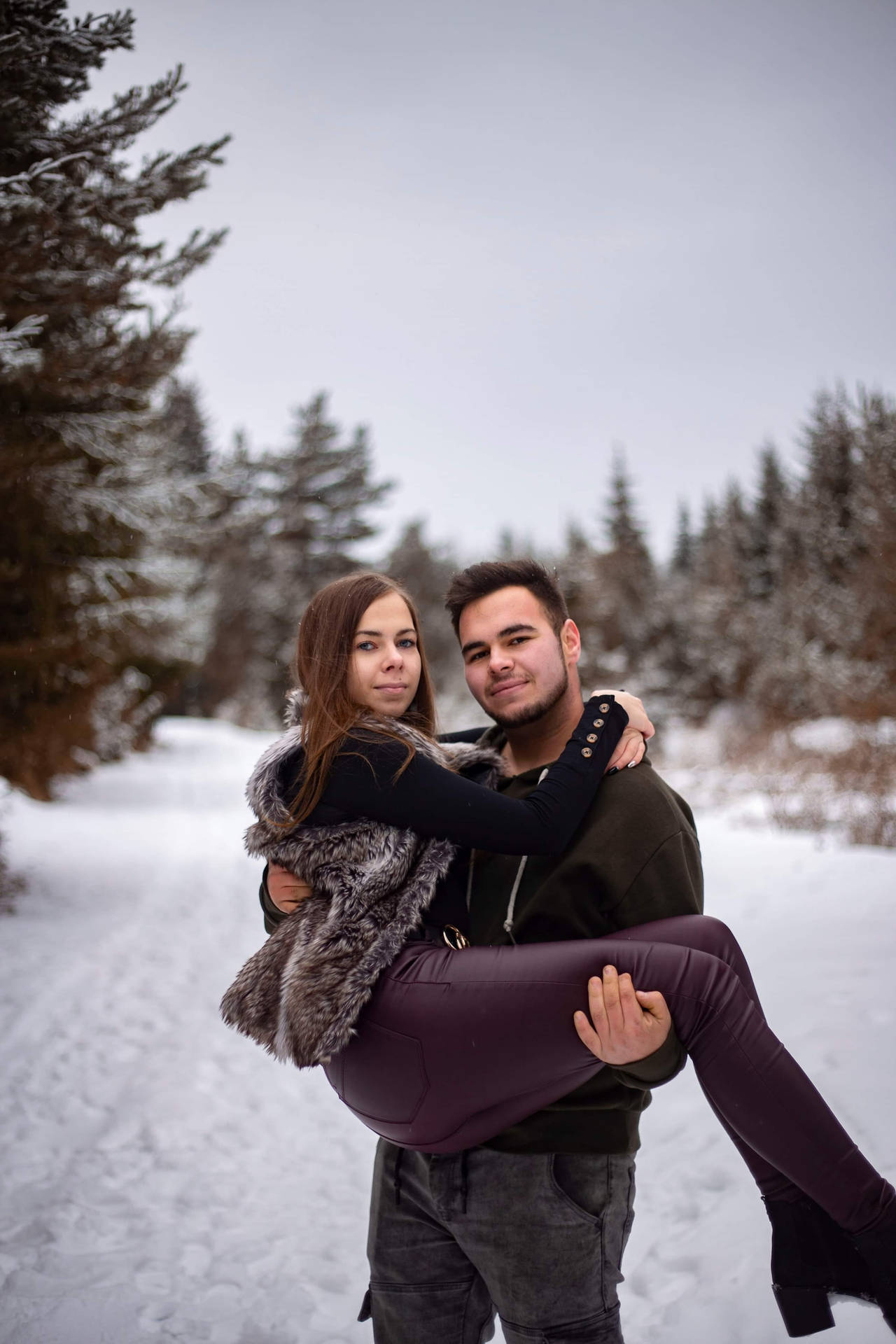 Couple Hugging In Bridal Carry Position At Winter Wallpaper