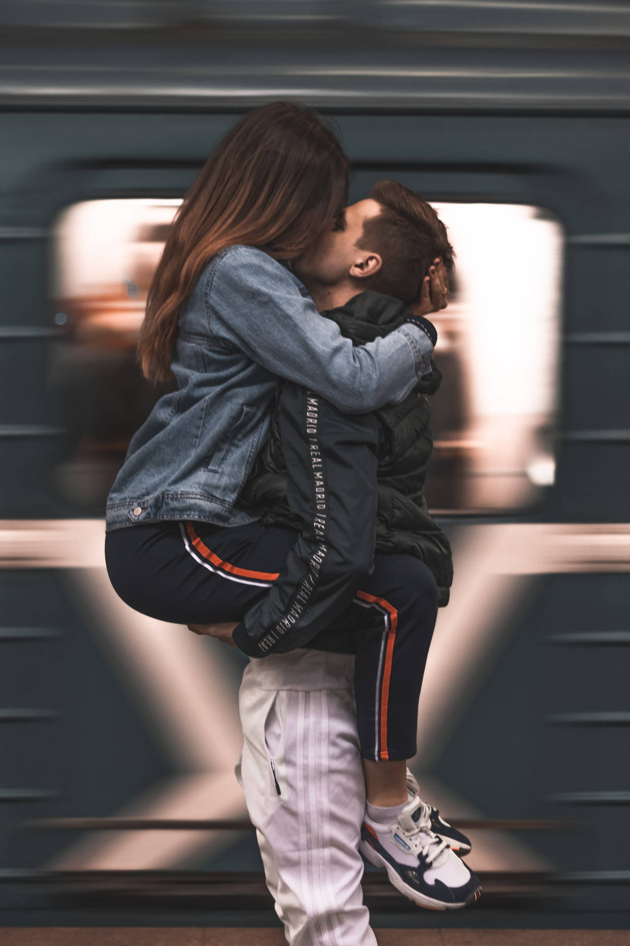 Couple Hugging In Straddle Hug Position With Motion Blur Wallpaper