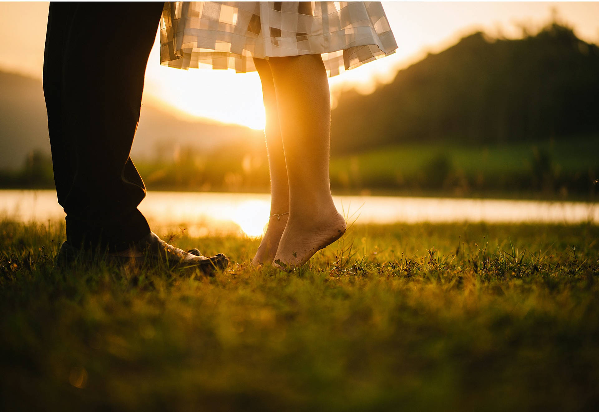 Couple In Love Feet On Green Grass Wallpaper