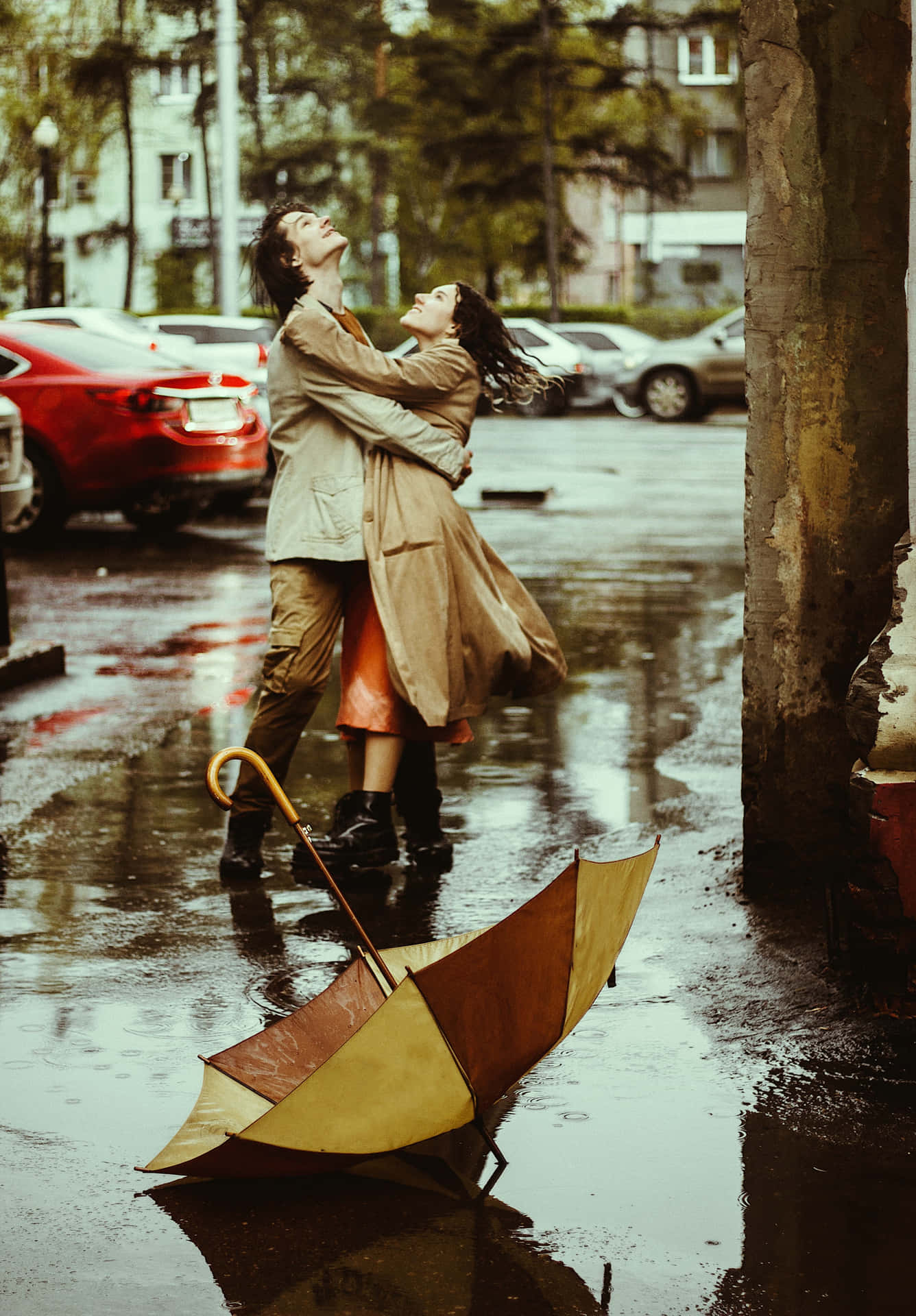 A romantic moment in the rain.