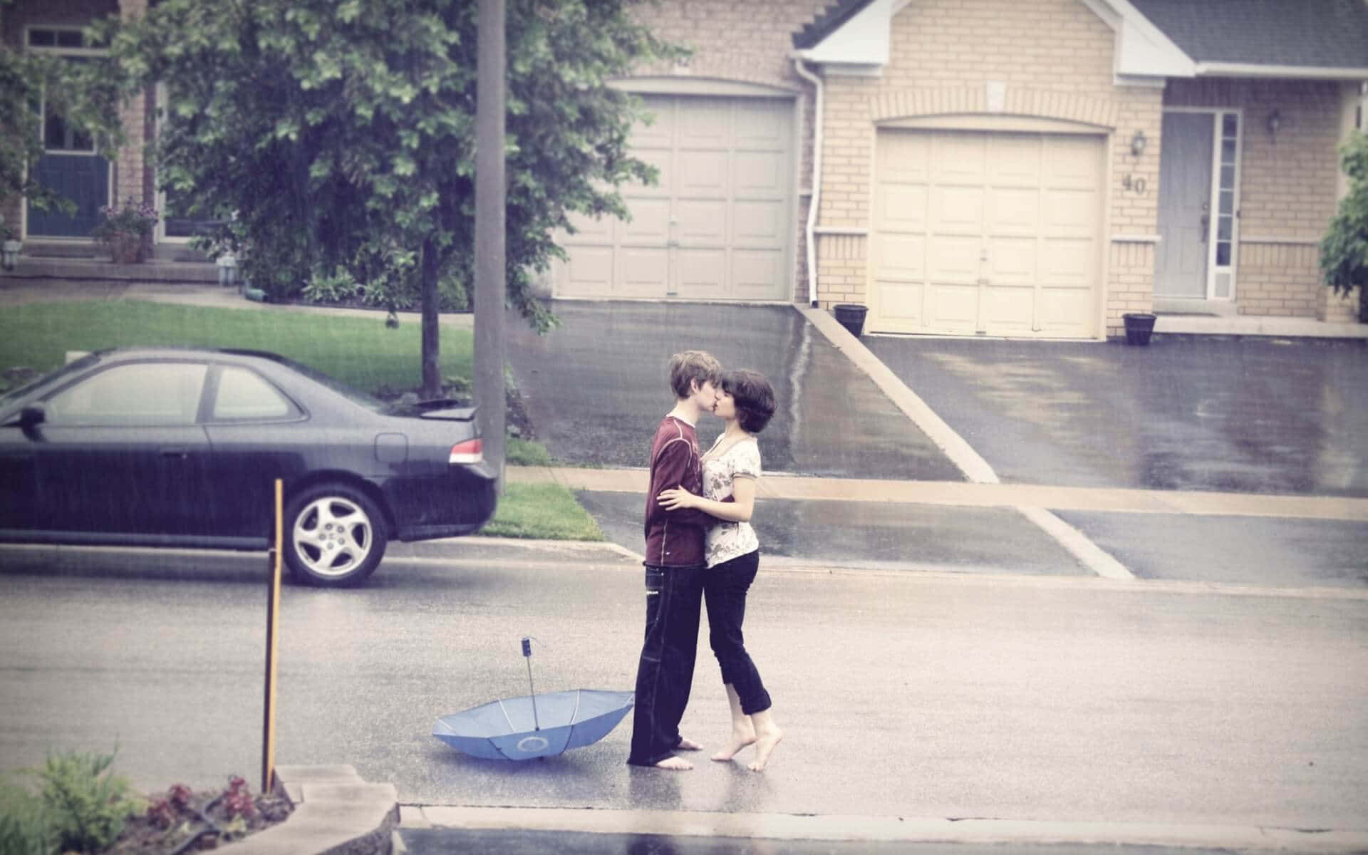 Young Couple In Rain Kissing Picture