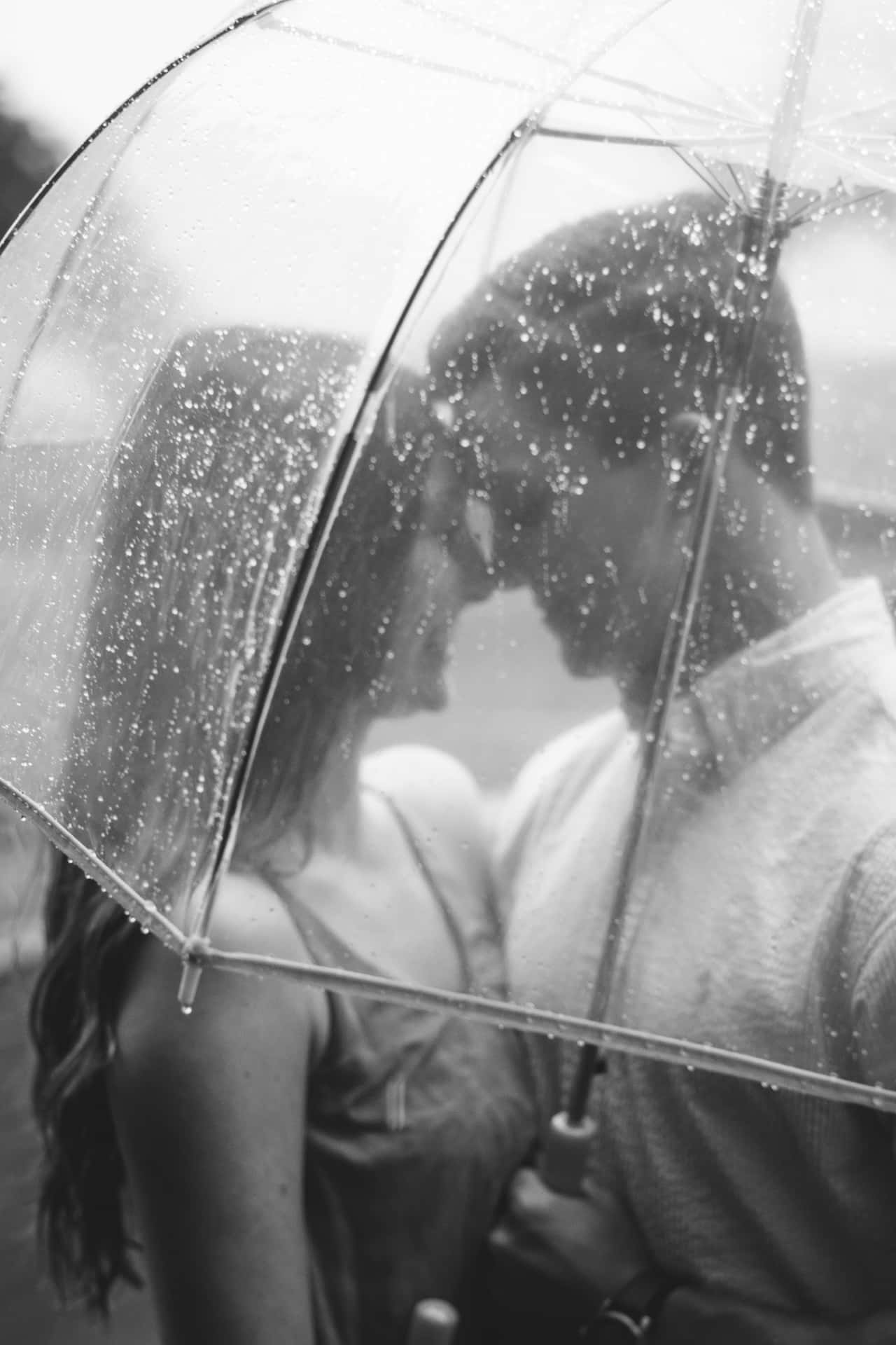 "Two lovers embracing in the rain"