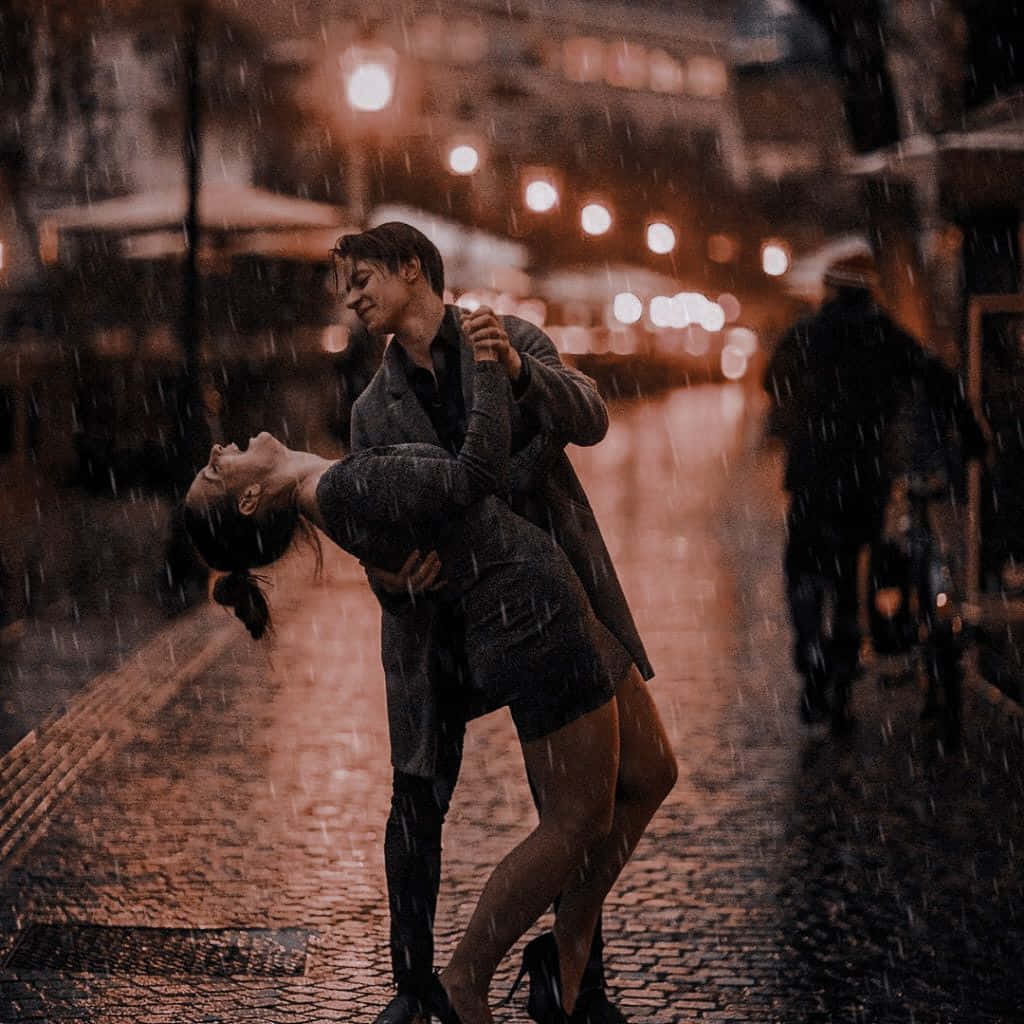 A romantic moment between two lovers in the rain