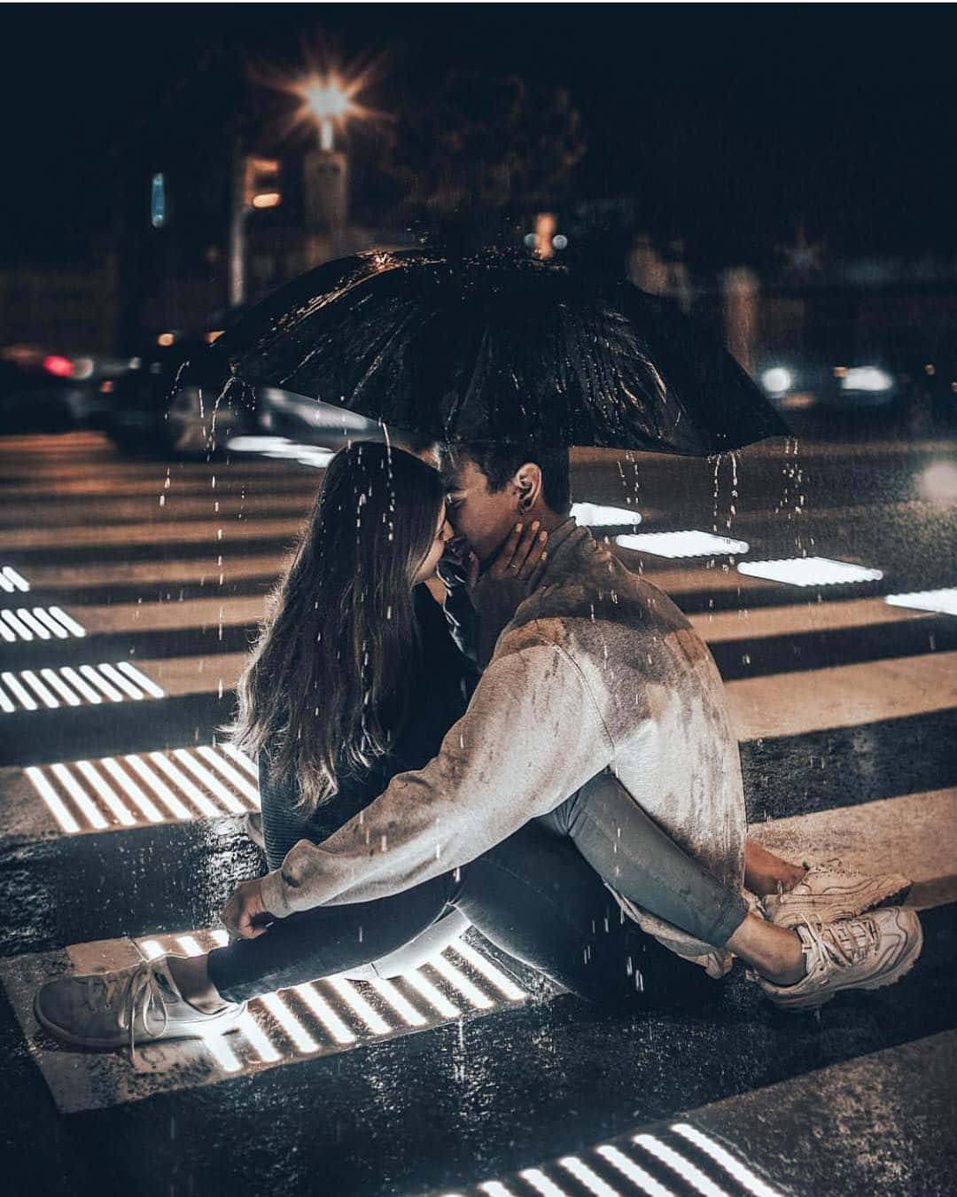 Two lovers embracing in the rain