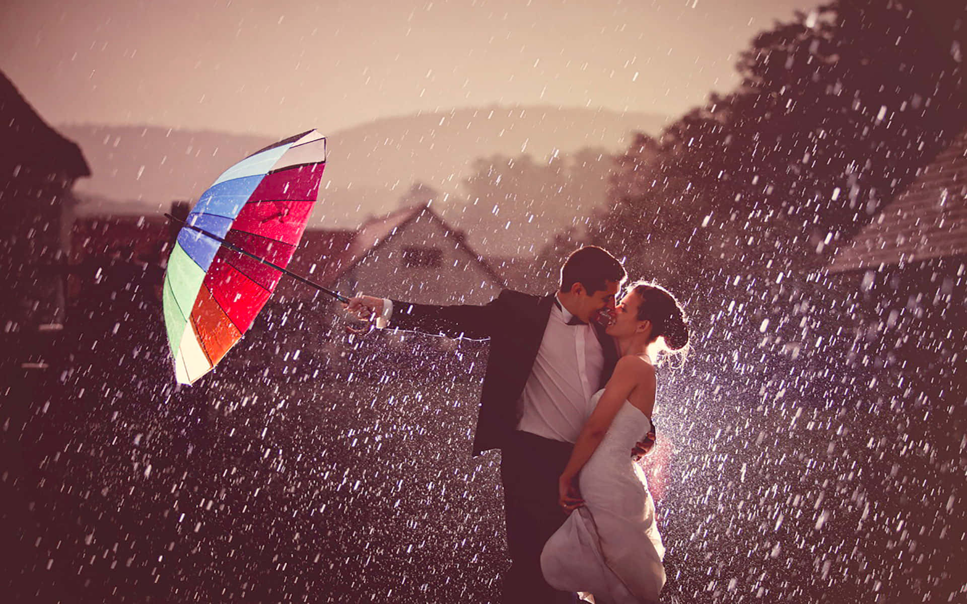 A loving couple in the embrace of a gentle rainfall.