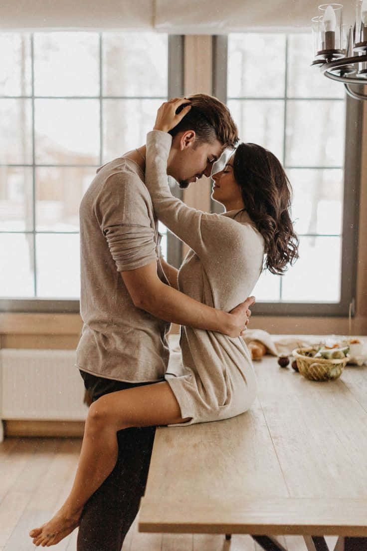 Couple Kissing In The Kitchen Picture
