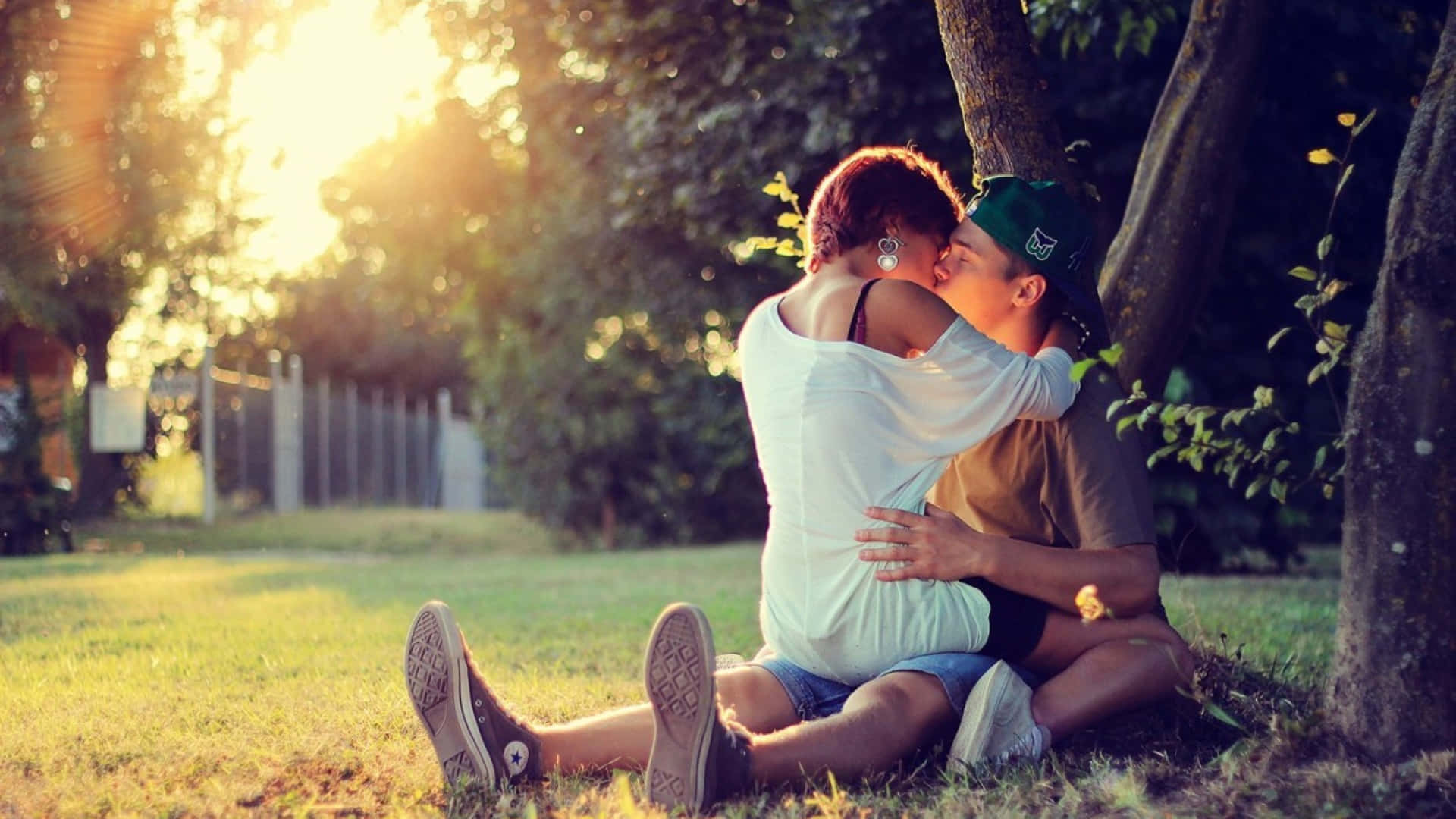 Couple Kissing Sitting On The Ground Picture