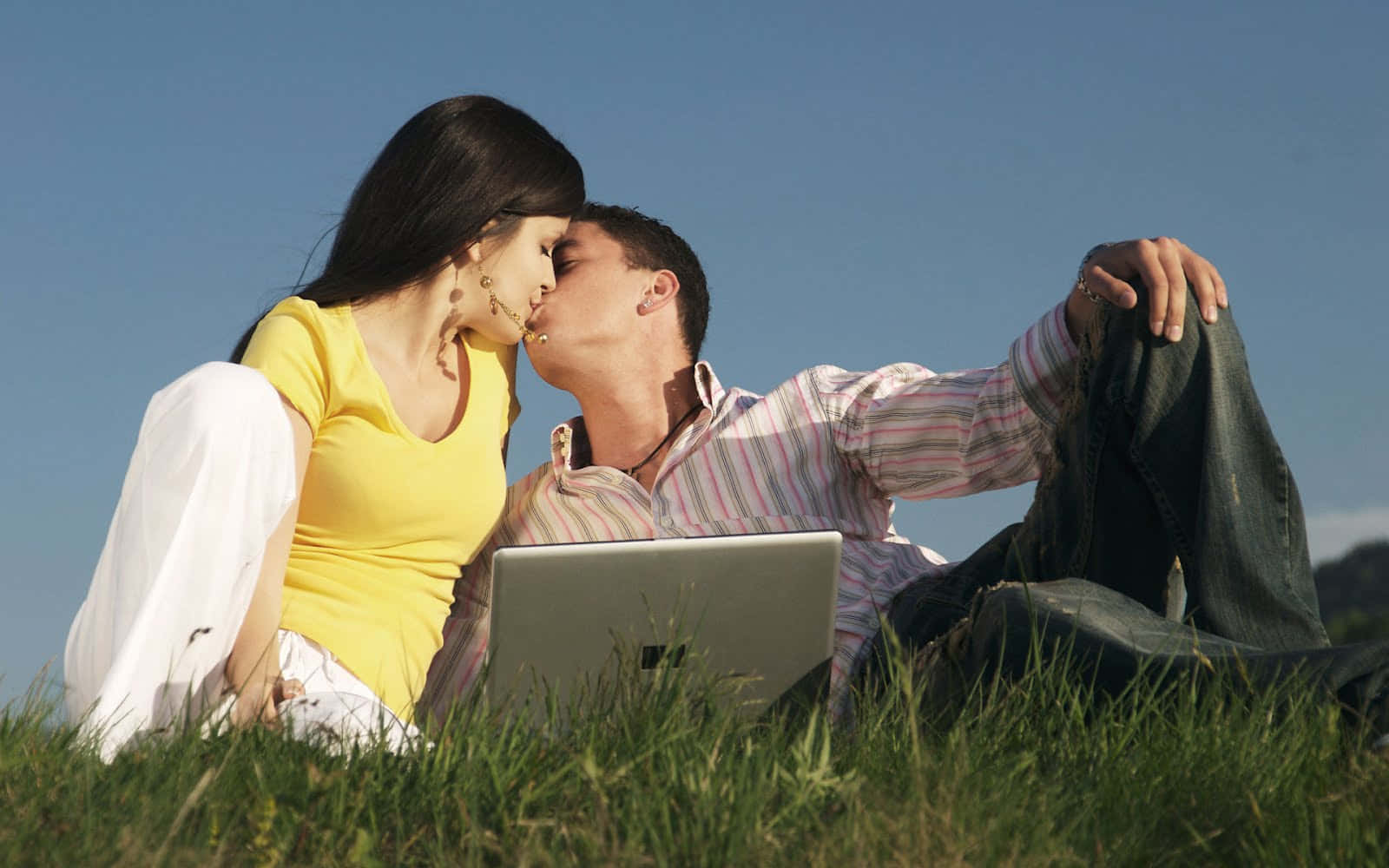 Couple Kissing With Laptop Picture