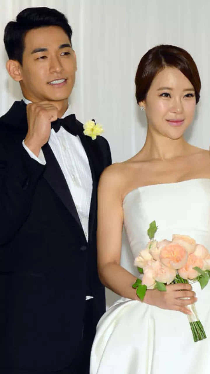 Koreanischespaar Jung Suk-won Und Baek Ji-young Bild.