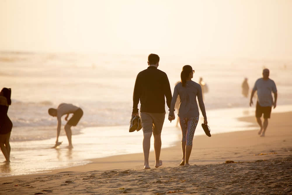 Couple Walking At Seashore Picture