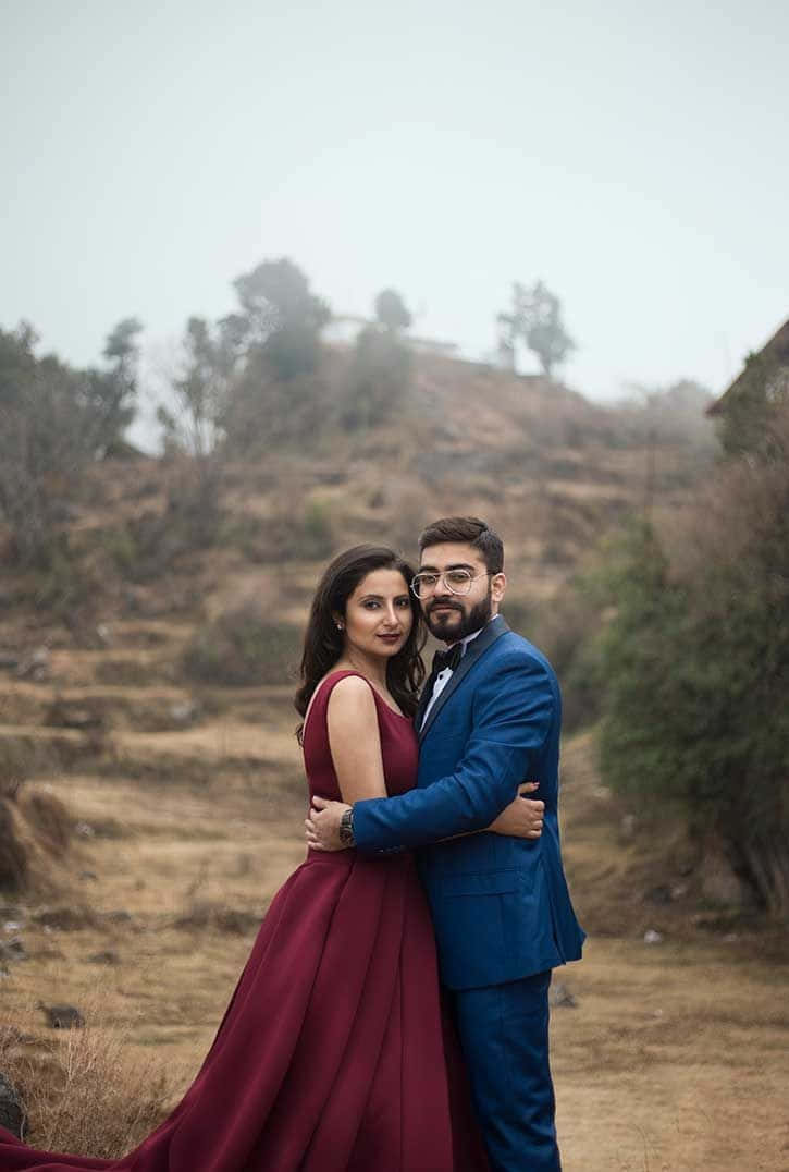 Premium Photo | A young couple in formal wear poses for a photo.