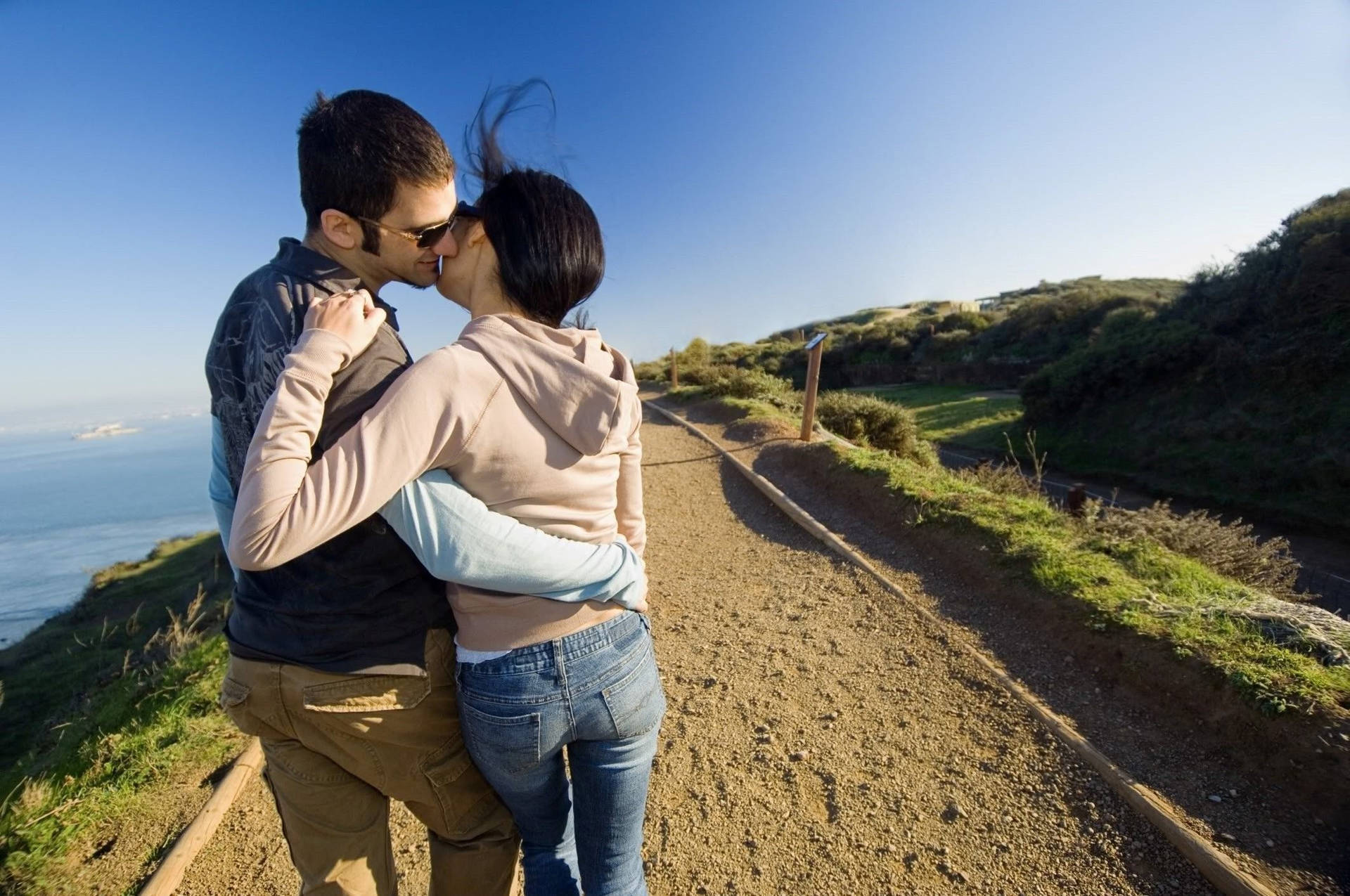 Couple's Romantic Love On A Hill