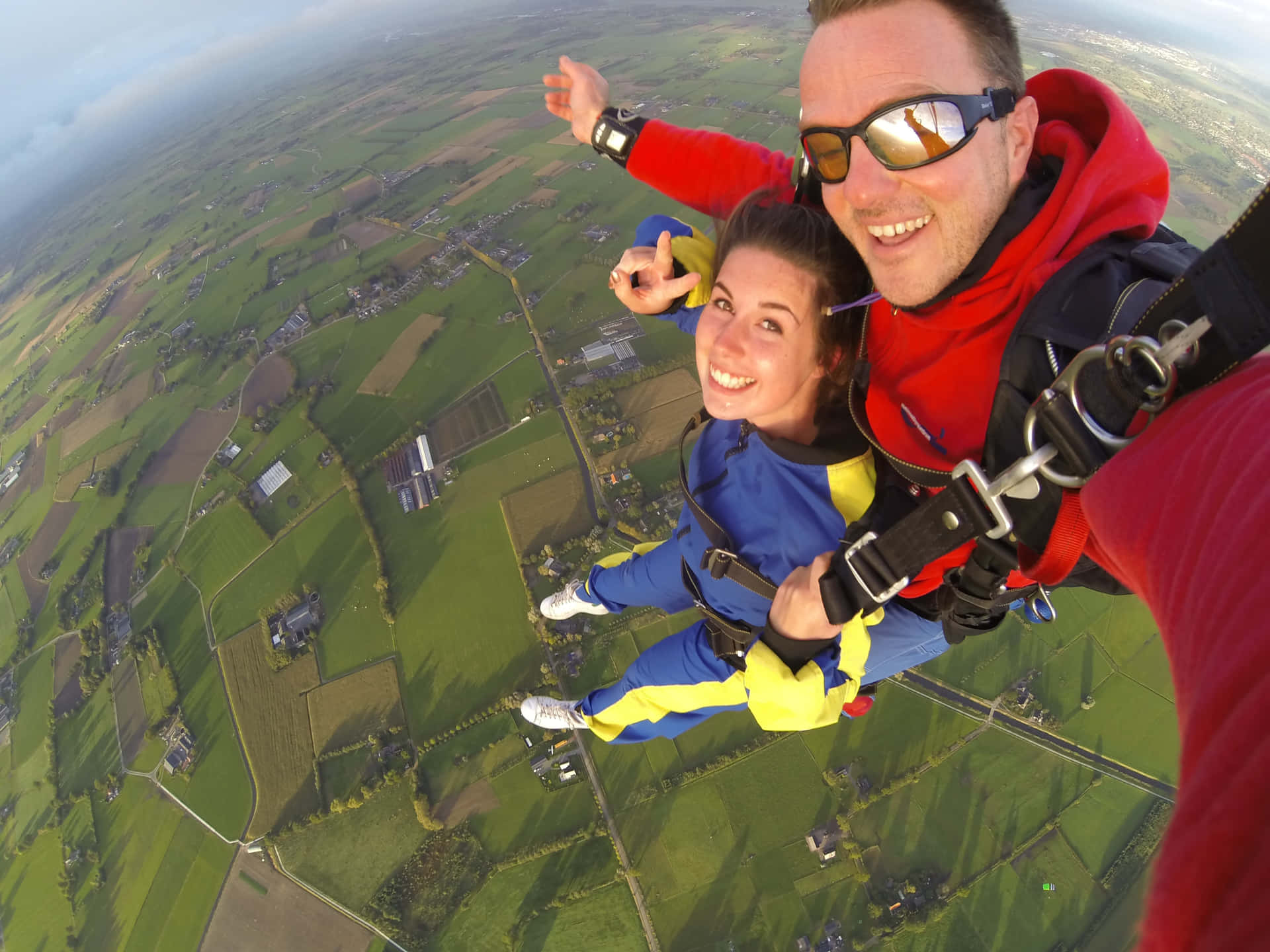Thrilling Skydiving Selfie Over Lithuania Wallpaper