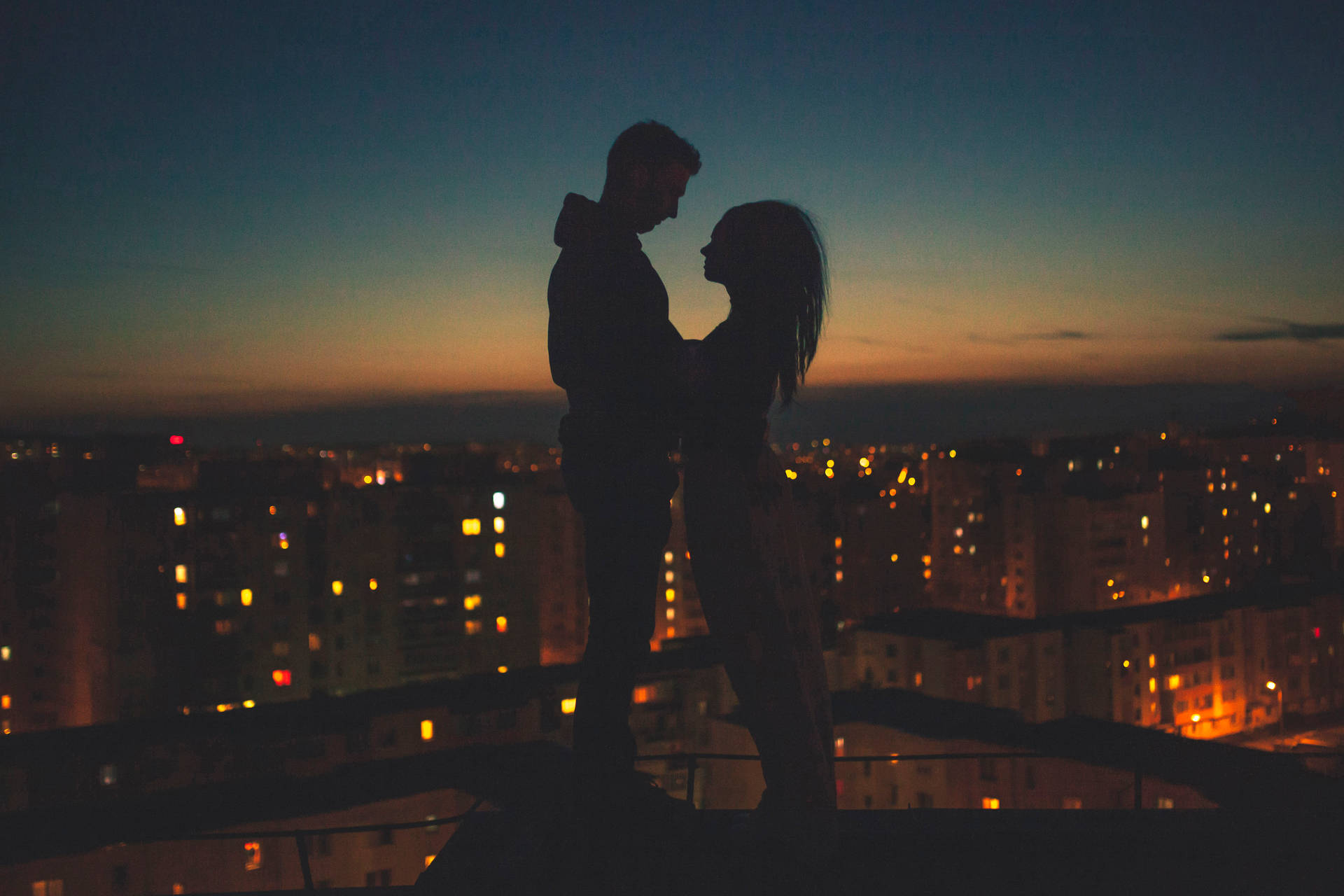 Couple Silhouette Top Of Building Background