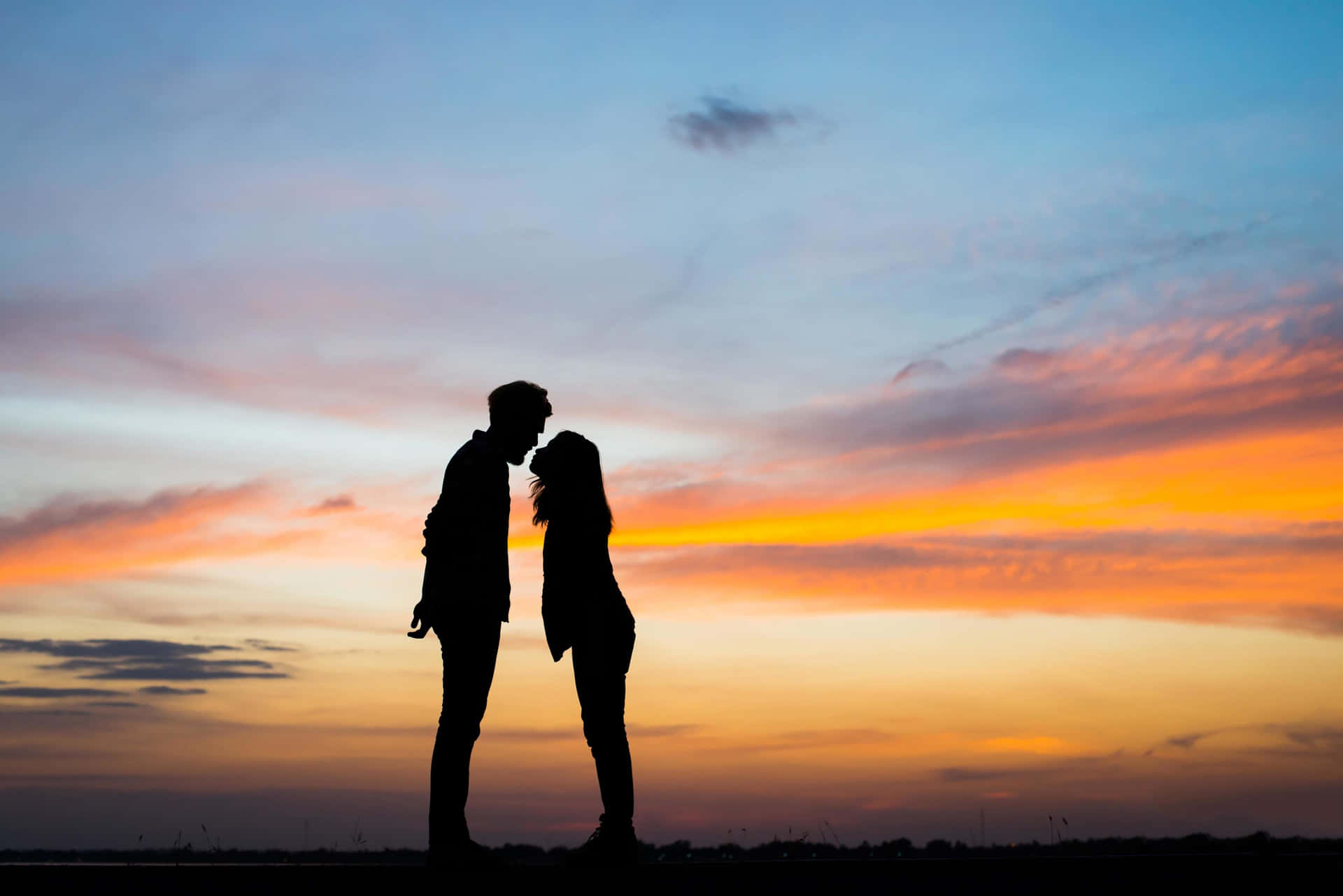 Couple Sunset Kissing Under Sunset Sky Picture