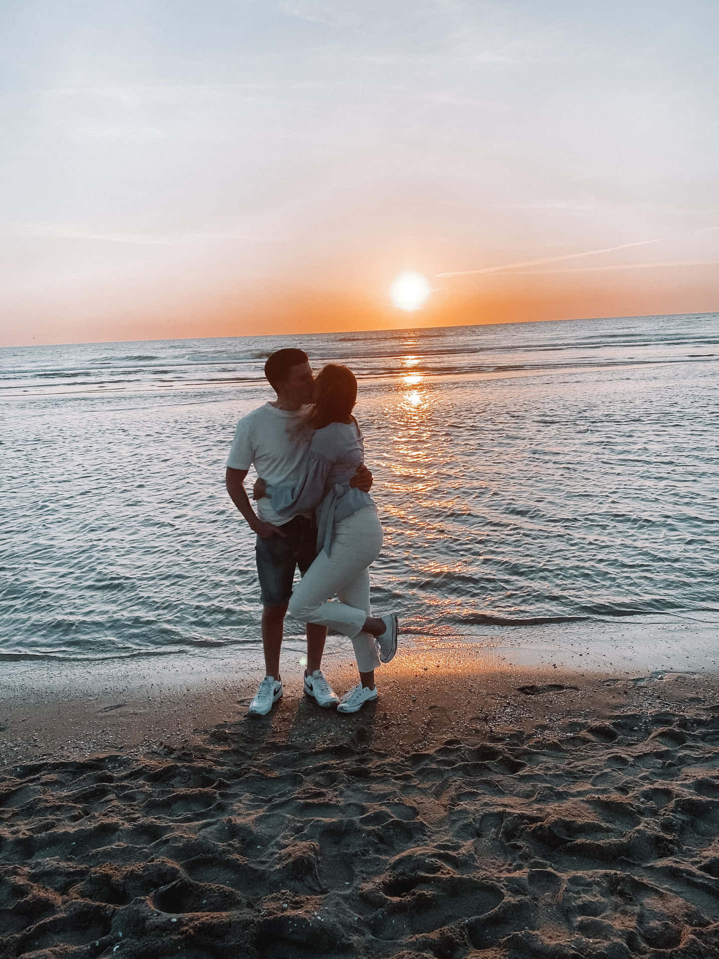 Couple Sunset Kissing In White At Beach Picture