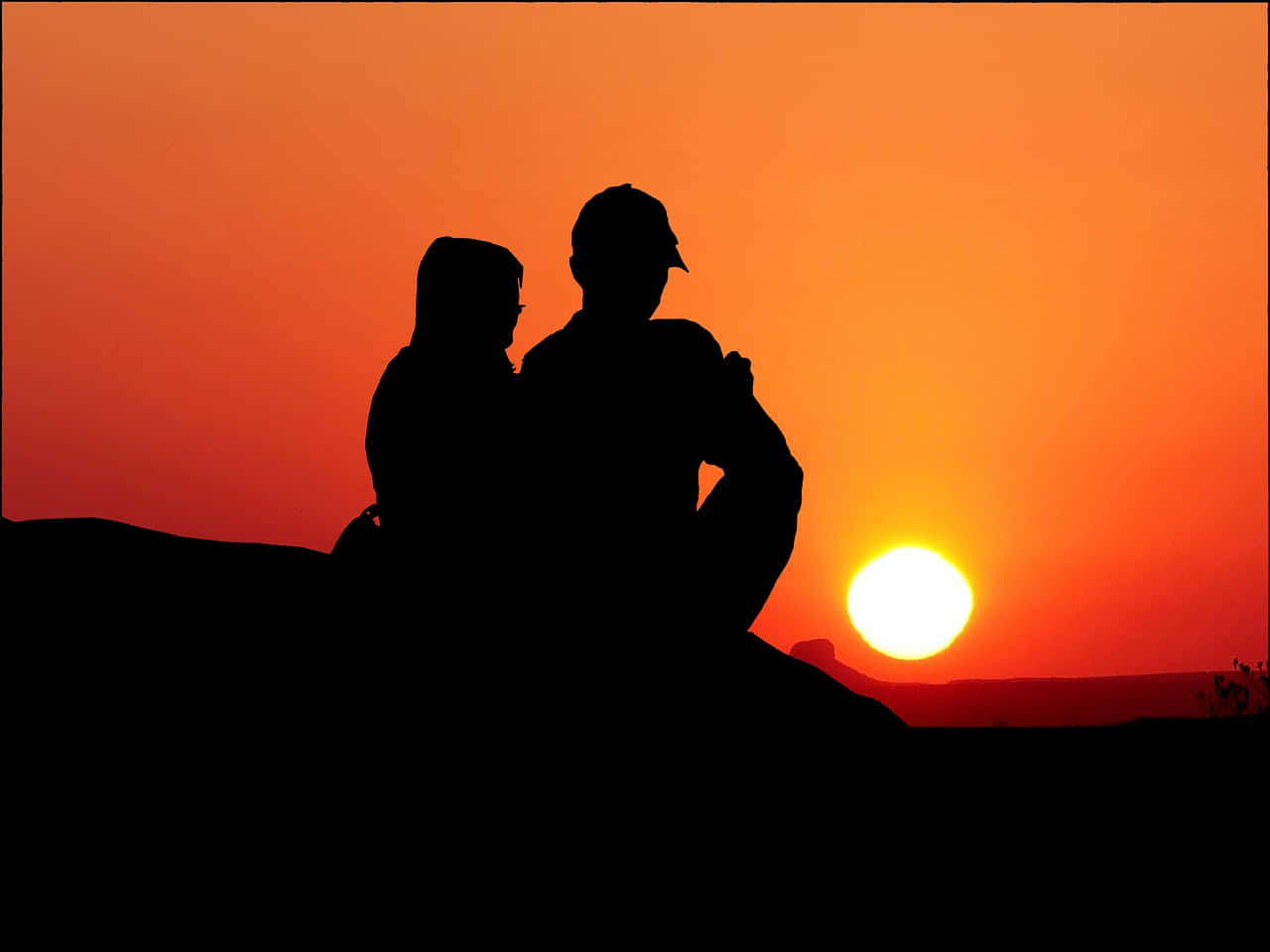 Par Silhuet Solnedgang og Solbillede til Afslappet Baggrund
