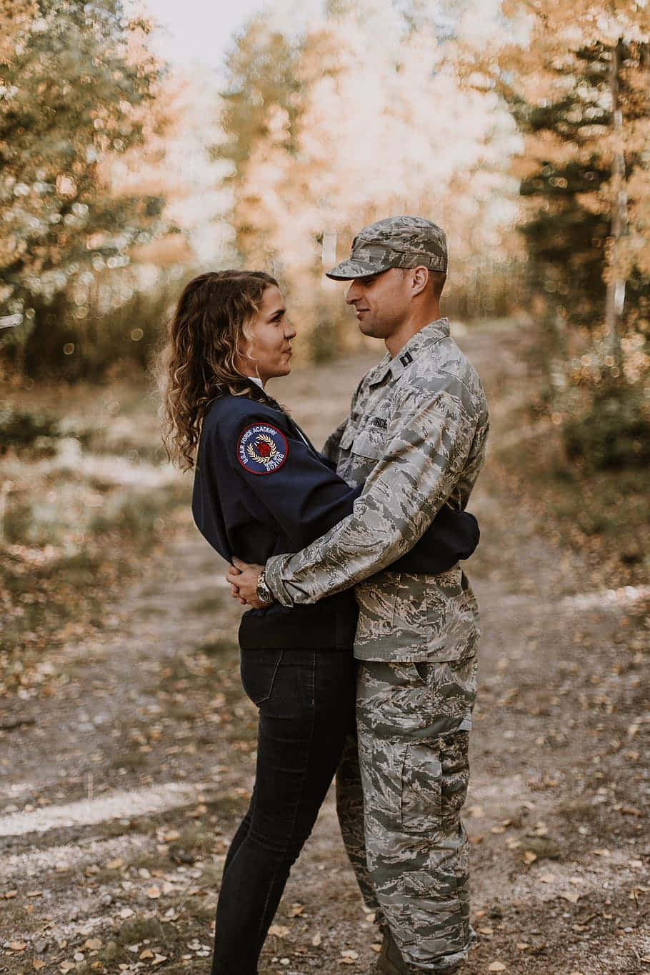 Couple Wearing Military Uniform Hugging Wallpaper