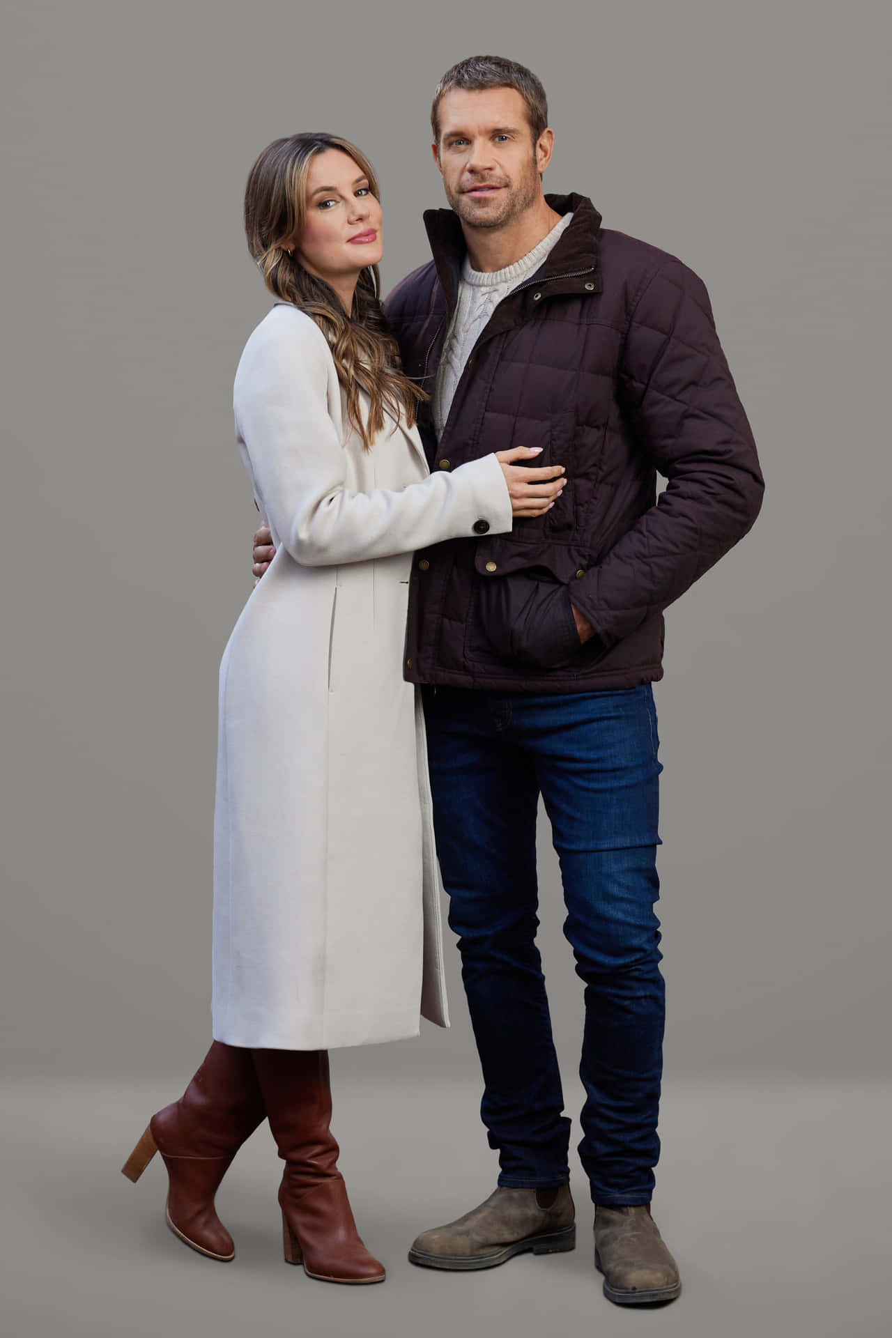 Couplein Winter Attire Portrait Wallpaper