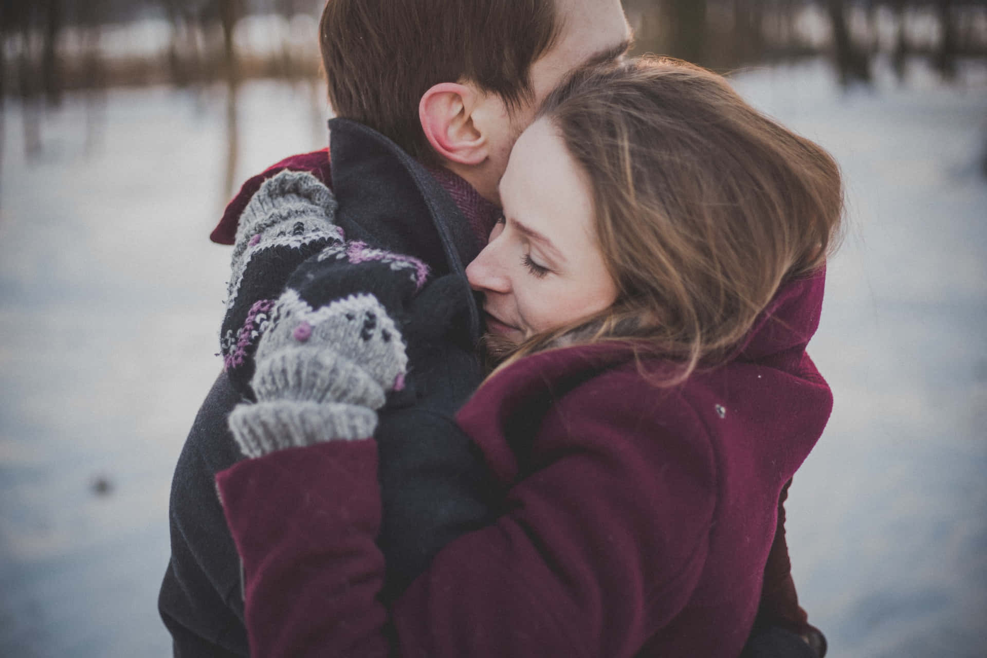 Couples Hugging In Snowy Area Picture