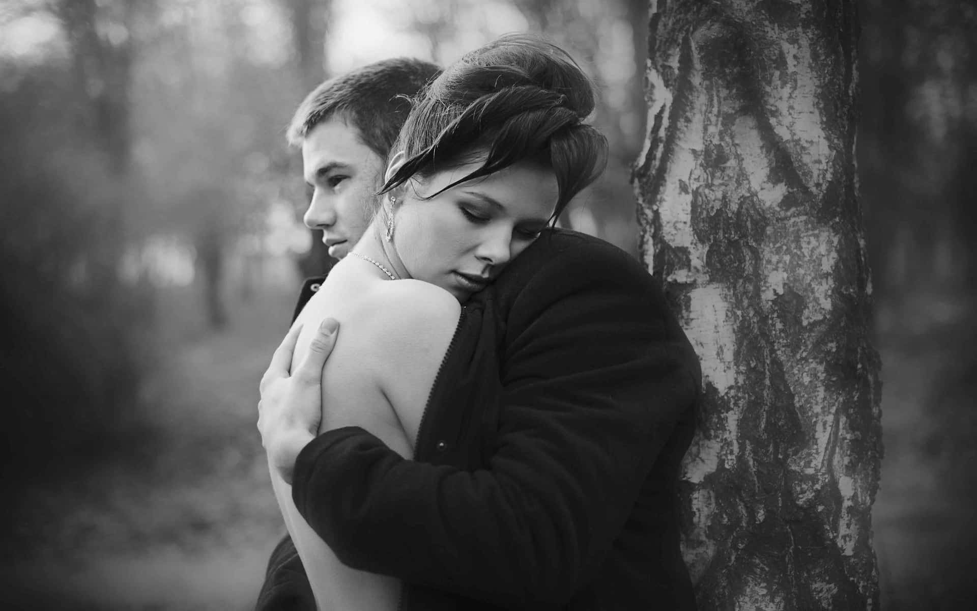 Couples Hugging Leaning On Tree Picture