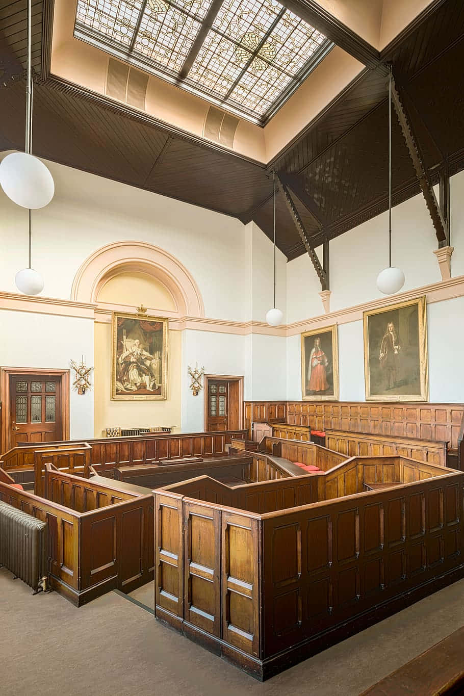 A Large Courtroom With Wooden Benches