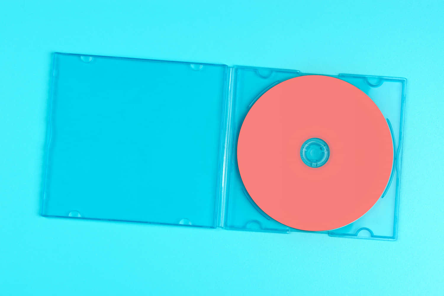 A Blue Cd Case With A Red Disc Inside