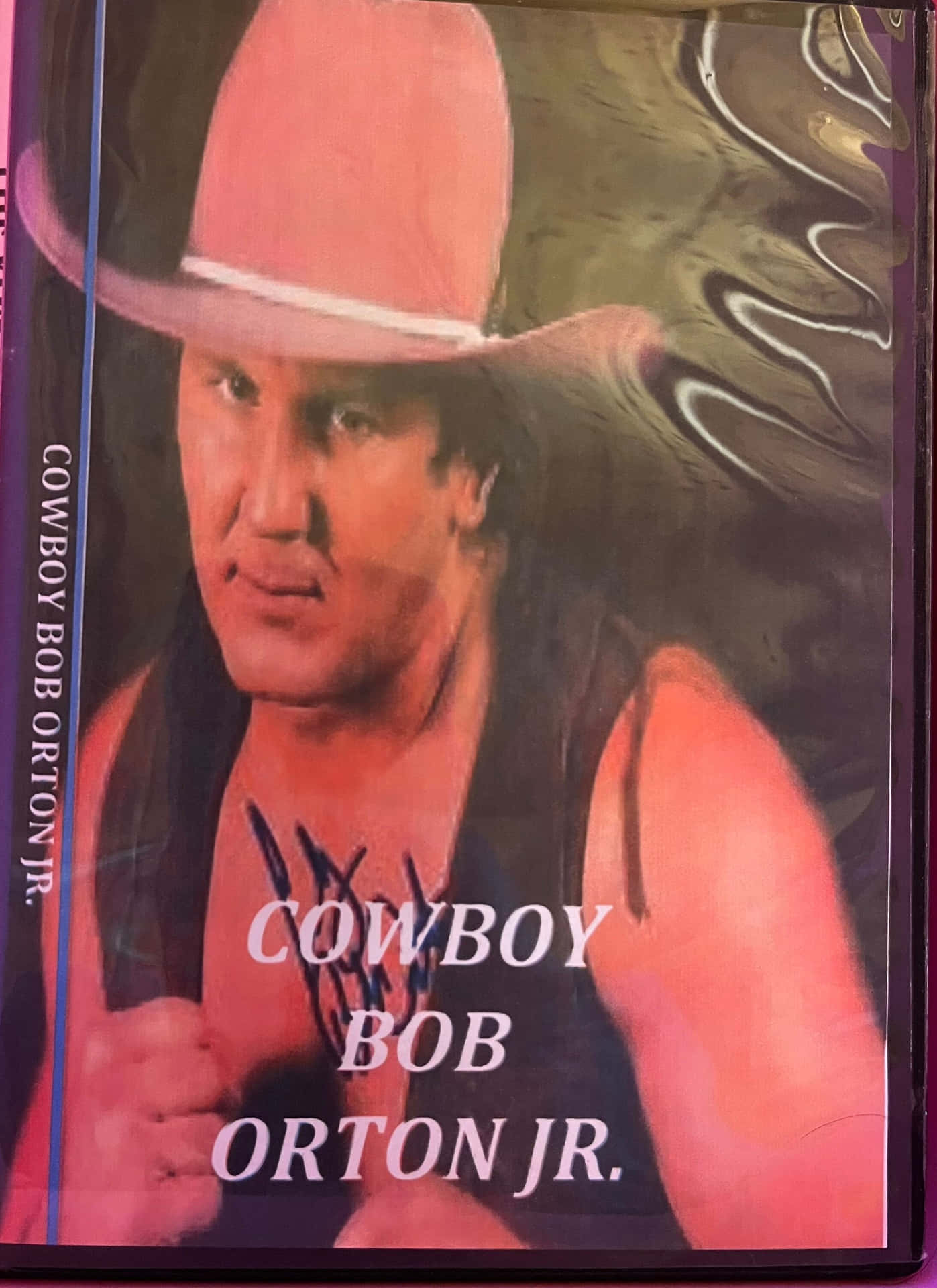 Cowboy Hat Bob Orton Jr. græsser på en solskinsdag Wallpaper