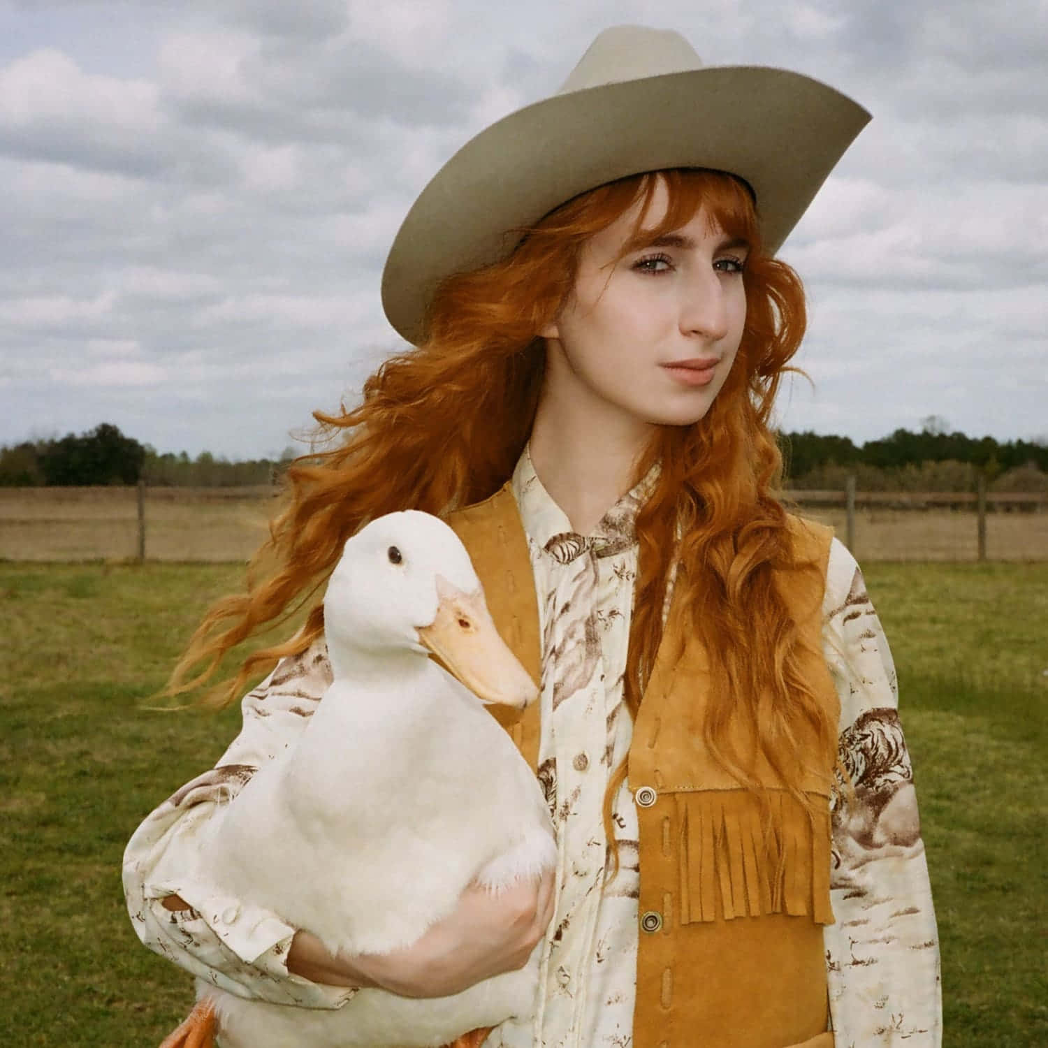Cowgirl Aesthetic Woman Posing With A Duck Wallpaper