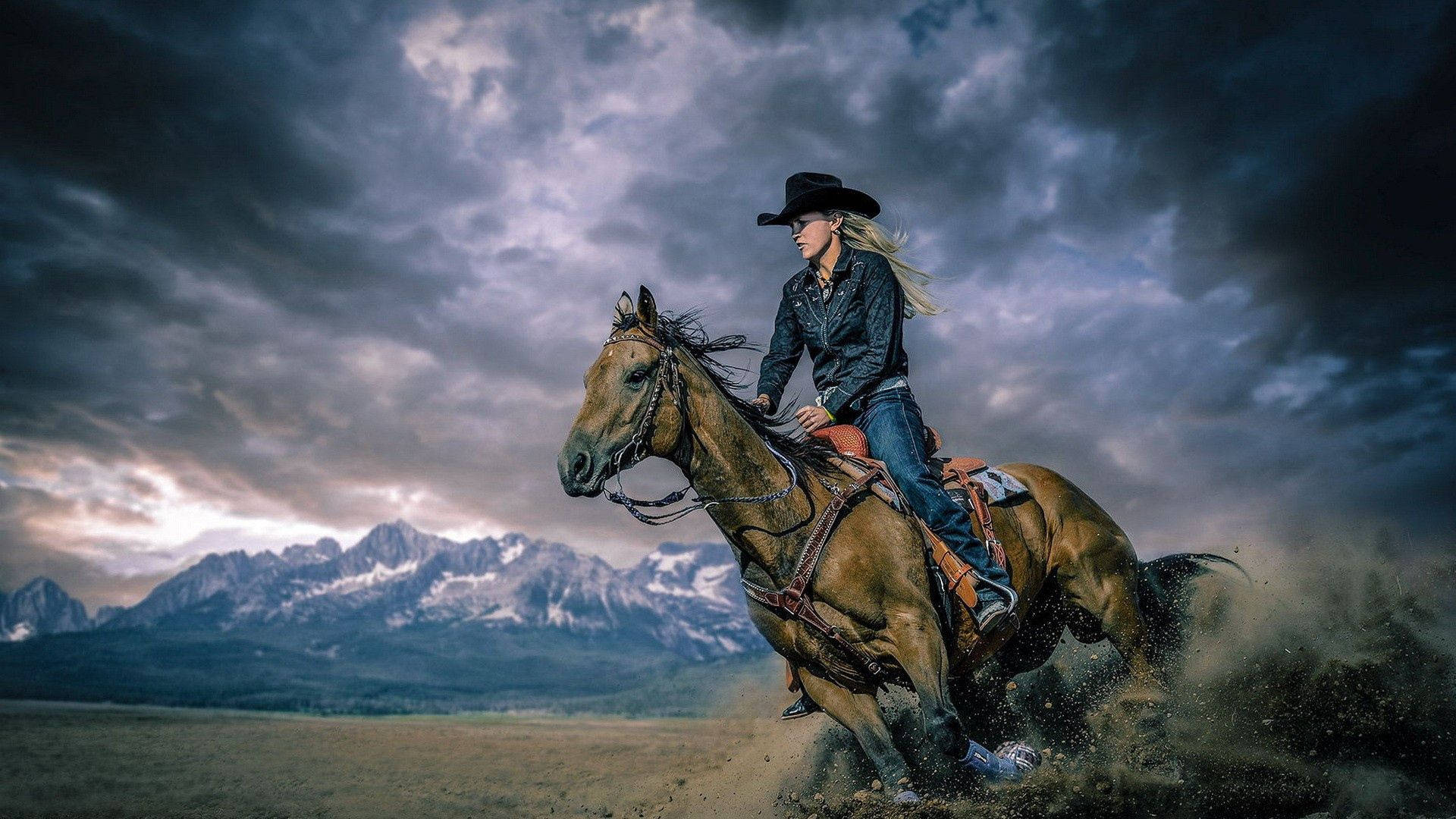 Cowgirl Riding A Horse Through Storm Wallpaper