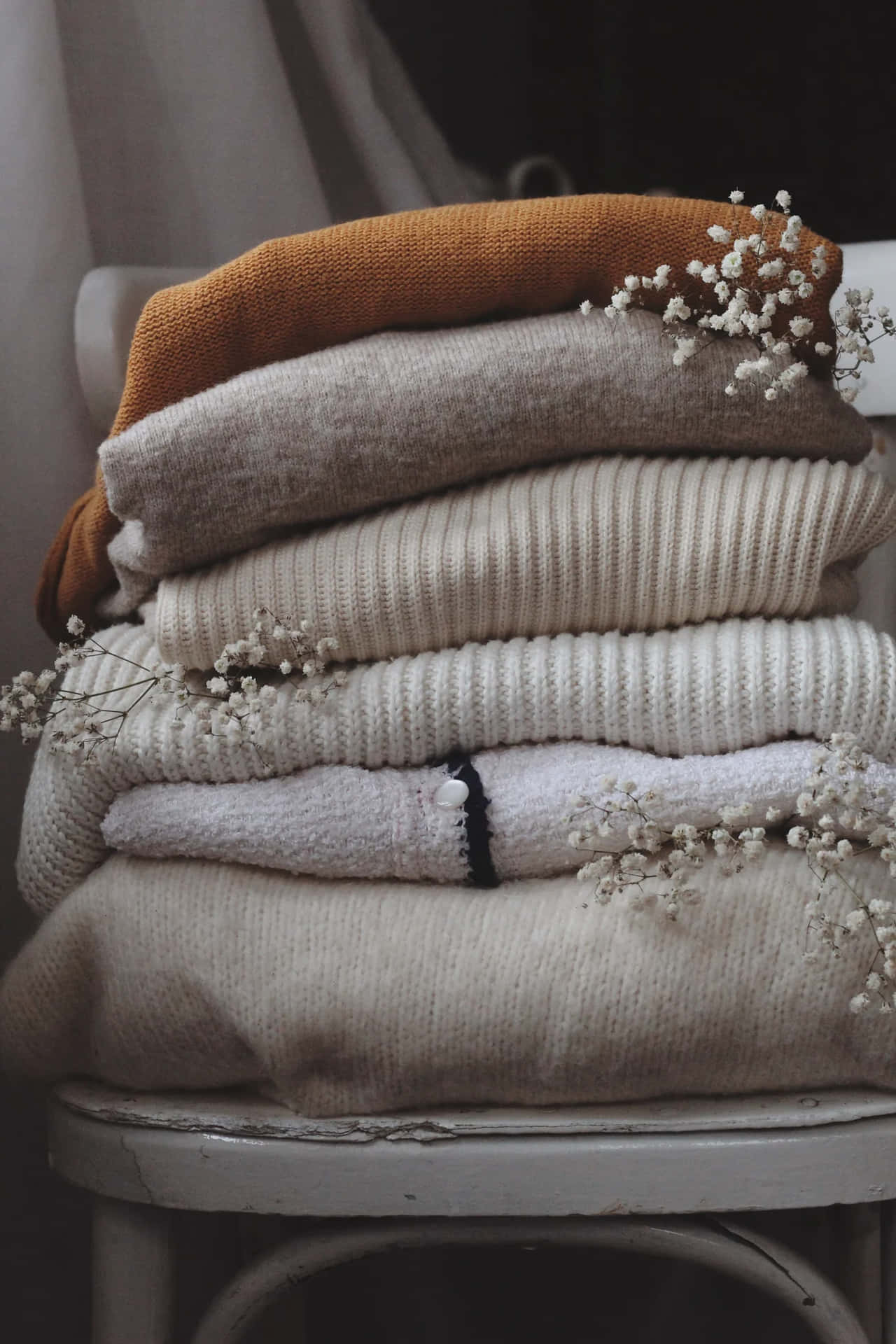 Cozy Autumn Sweaters Stack Wallpaper