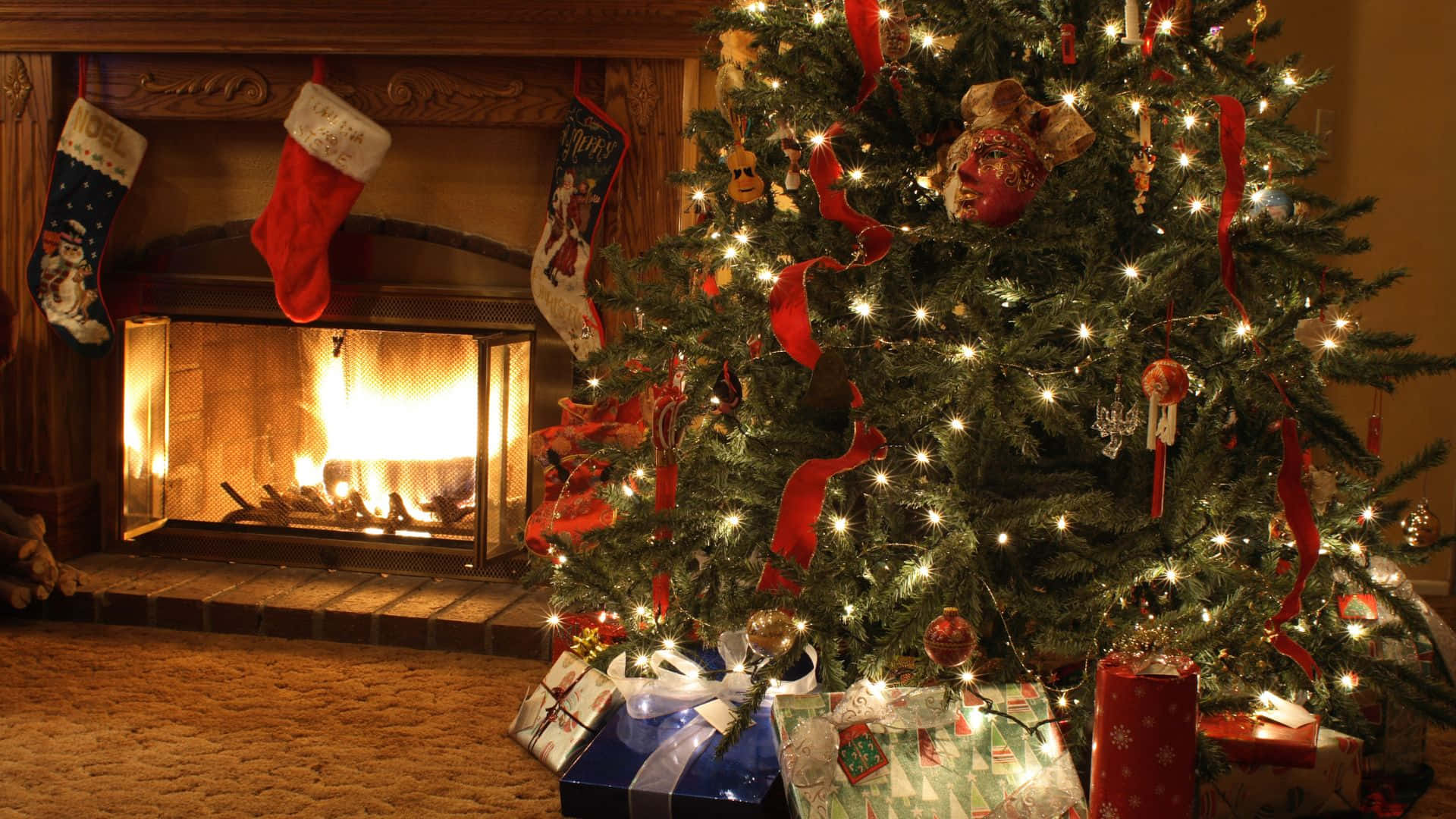 Cozy Christmas Treeand Fireplace Scene.jpg Wallpaper