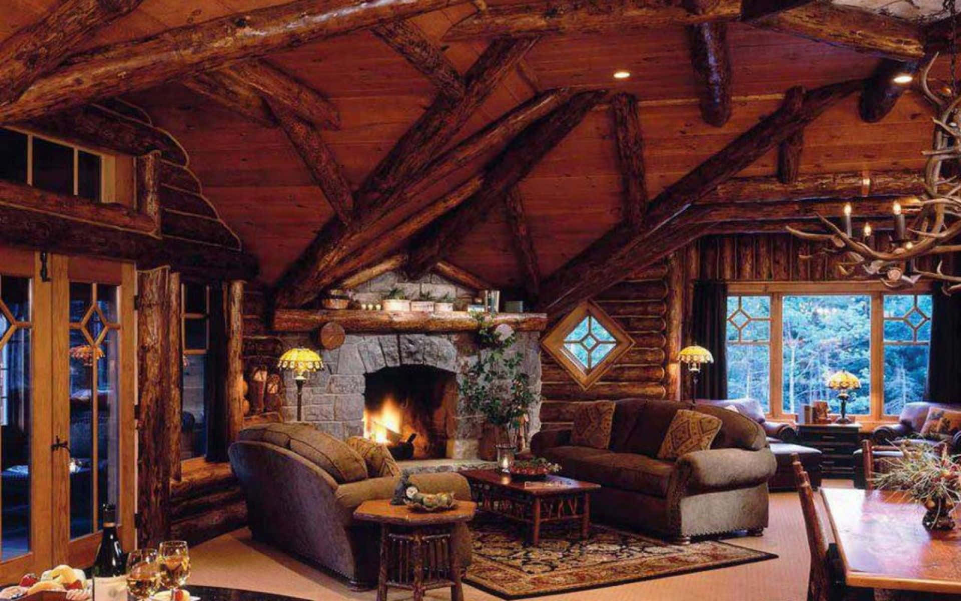 A Log Cabin With A Fireplace Wallpaper