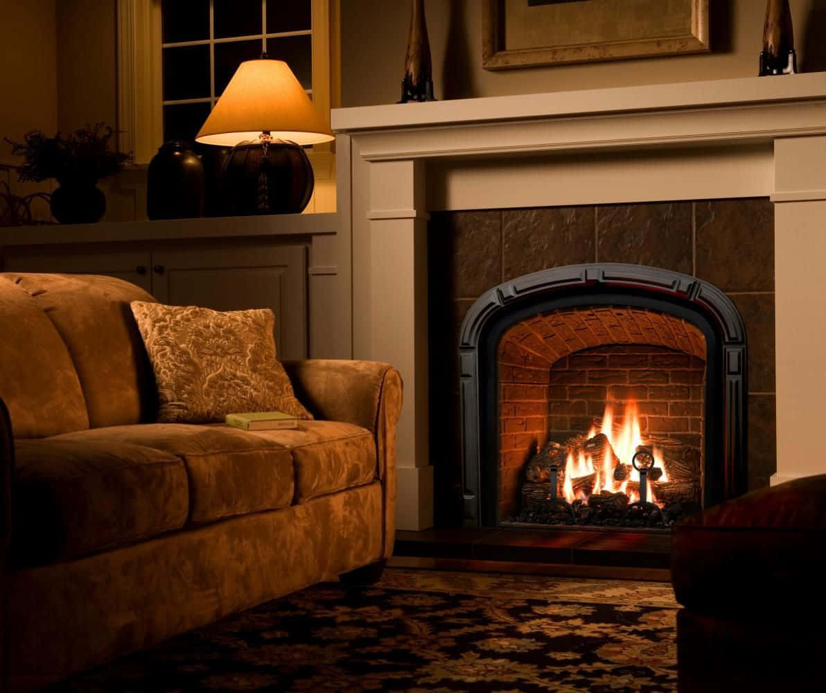 A warm and inviting fireplace with glowing fire Wallpaper