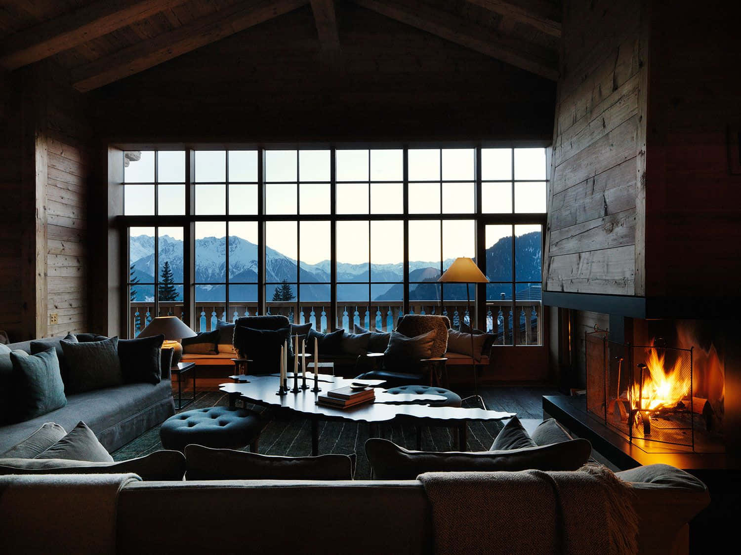 Warm and cozy fireplace in a rustic cabin Wallpaper