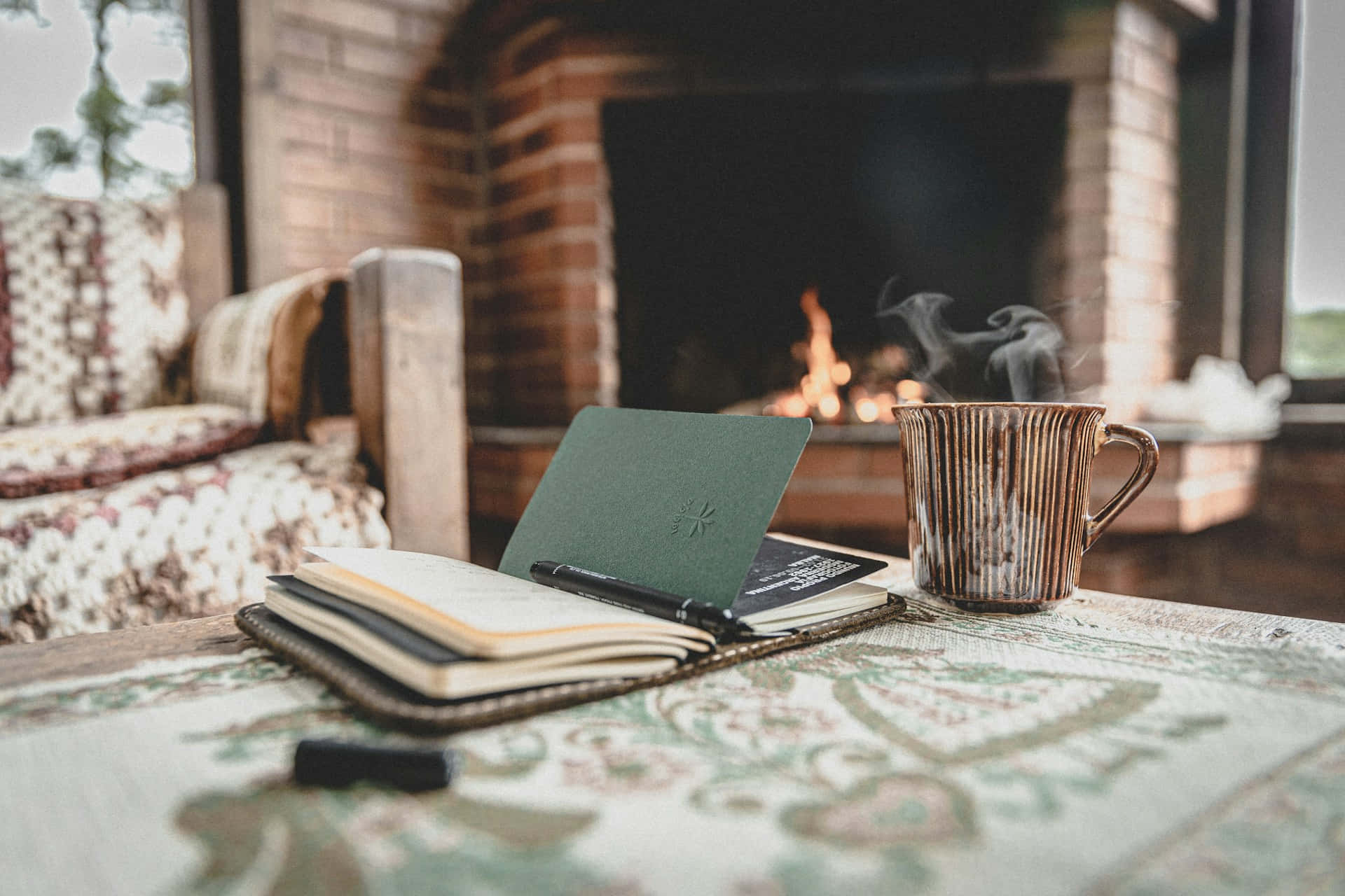 Cozy Fireplace Writing Session Wallpaper