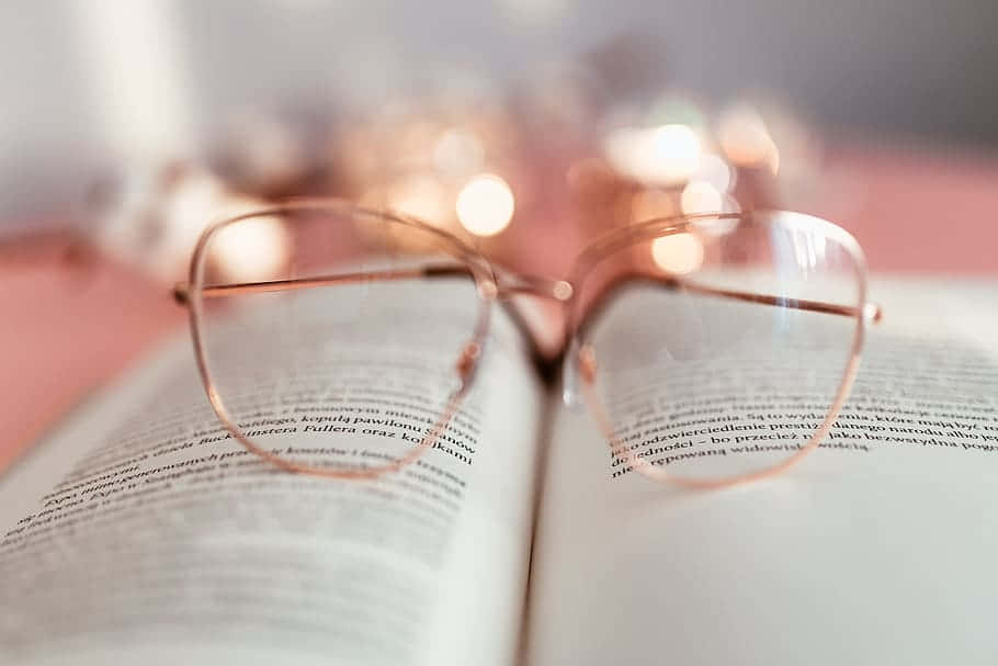 Cozy Reading Glasses And Book.jpg Wallpaper