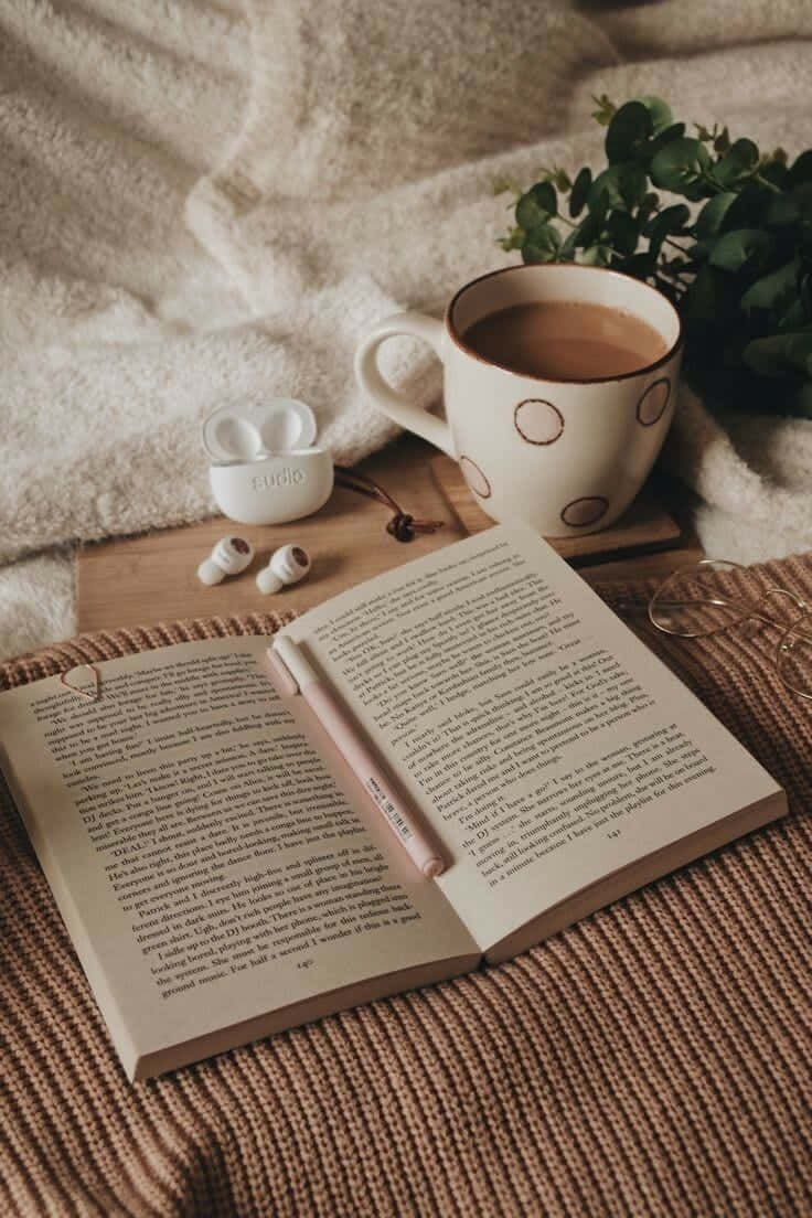 Cozy Reading Timewith Coffeeand Book.jpg Wallpaper