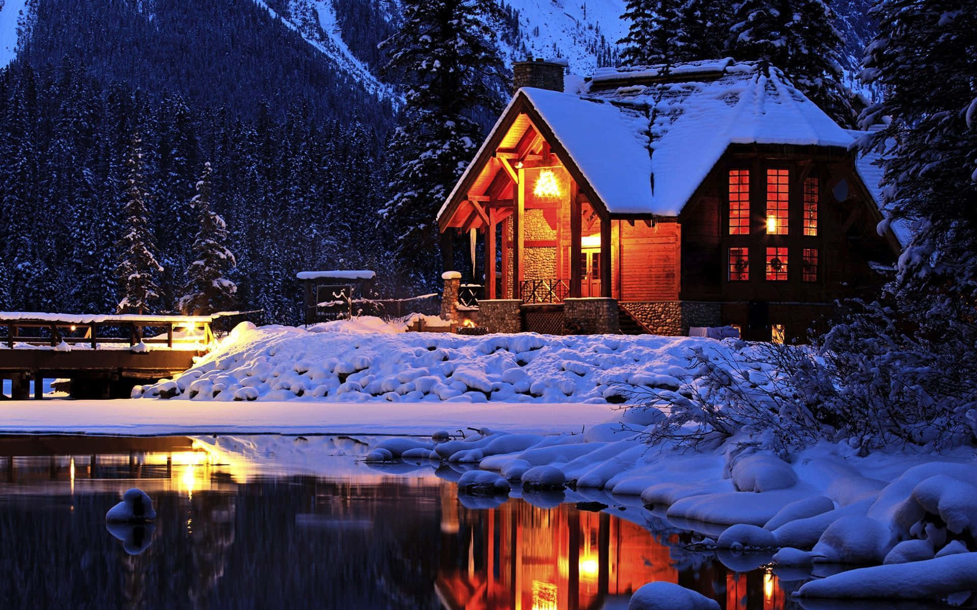 Caption: Serene Winter Cabin Retreat Wallpaper