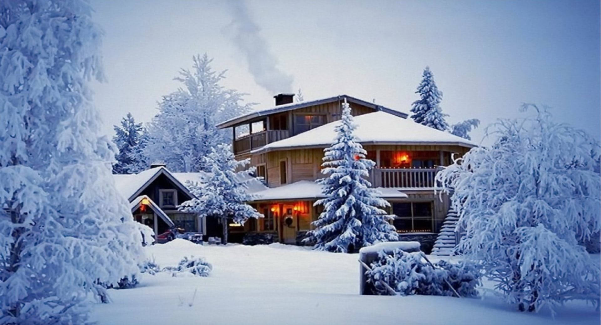 Cozy Winter Mansion Covered In Snow Wallpaper