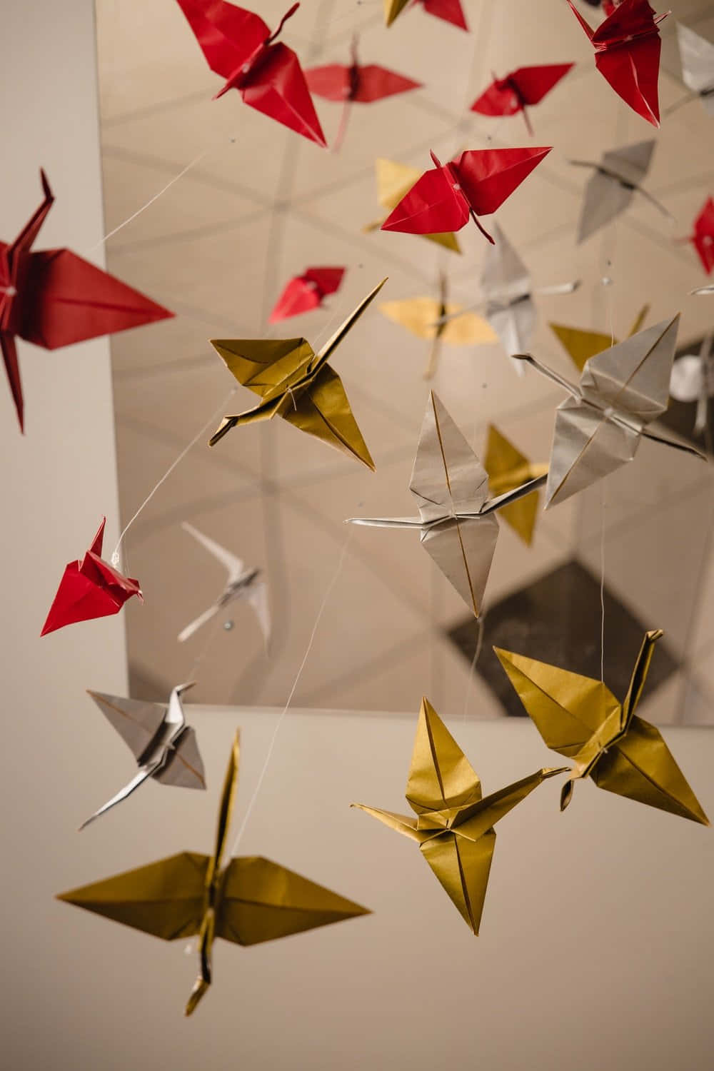 Origami Cranes Hanging From A Ceiling