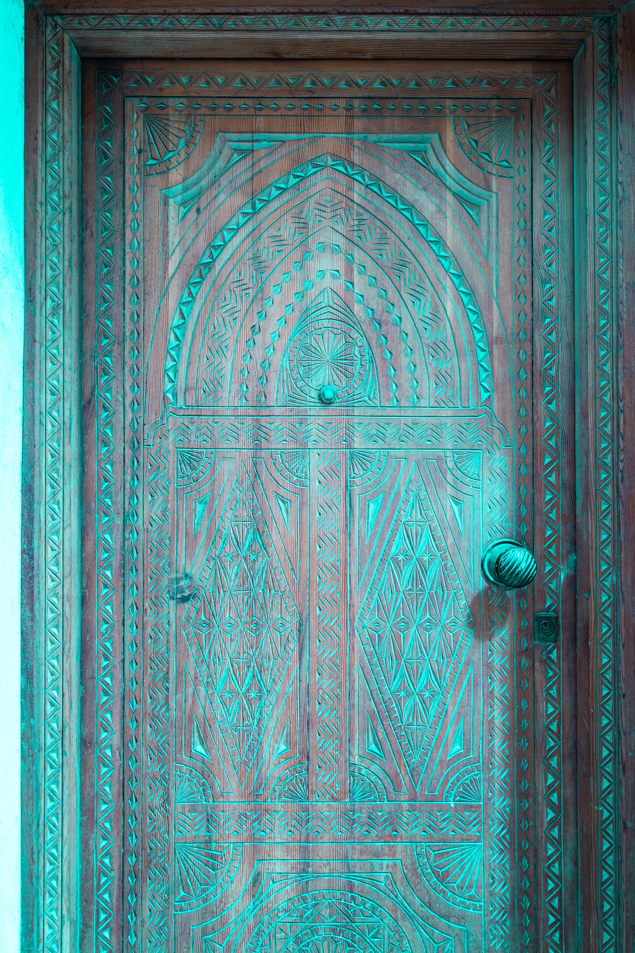 Craved Wooden Door In Moroccan Framework Wallpaper