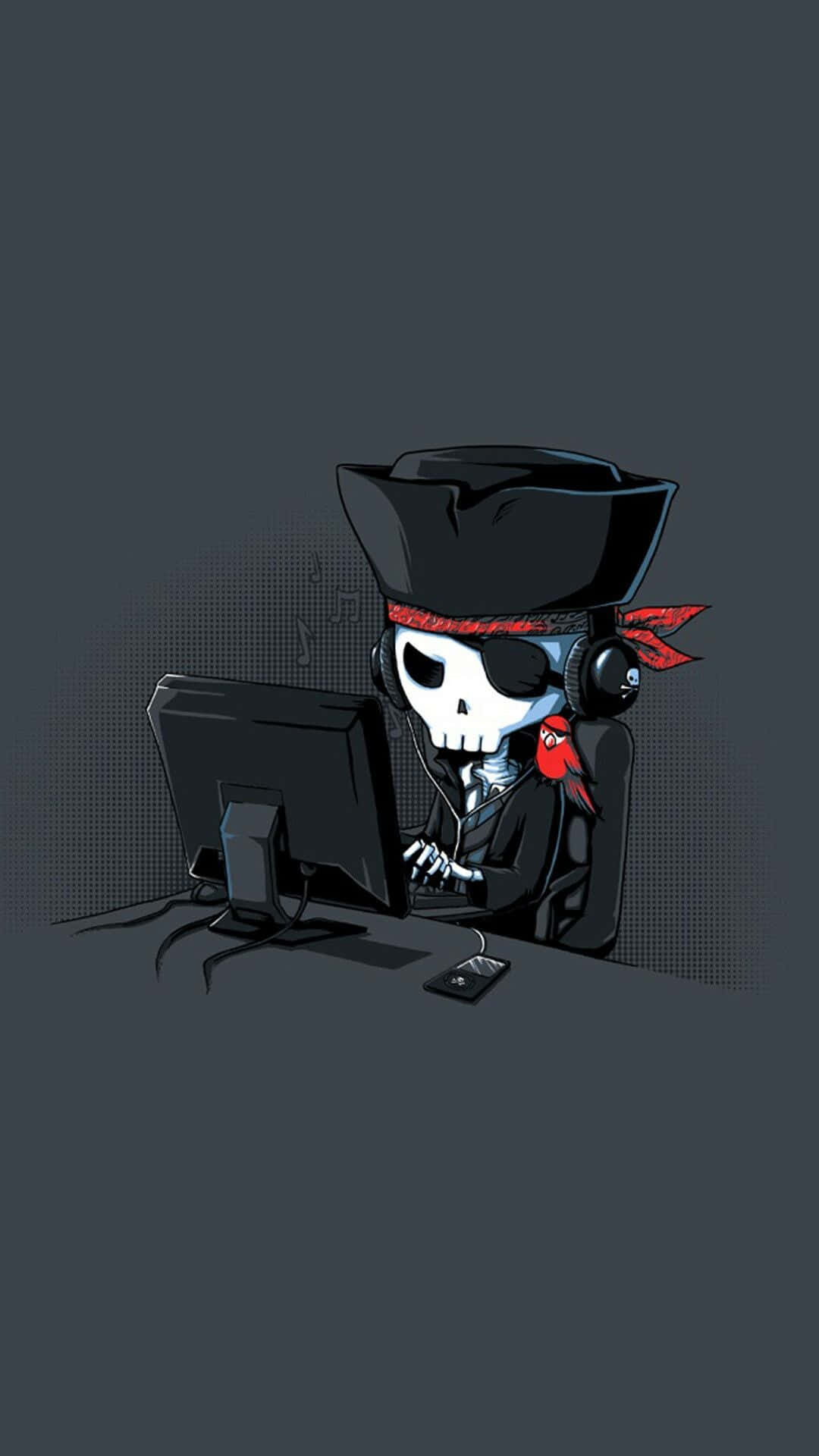 A Pirate Skull Sitting At A Computer Wallpaper