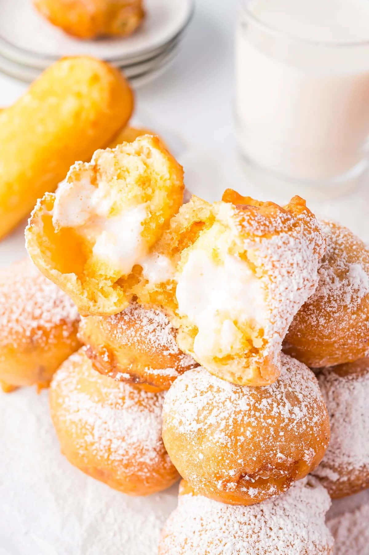 Cream Filled Pastrieswith Powdered Sugar Wallpaper